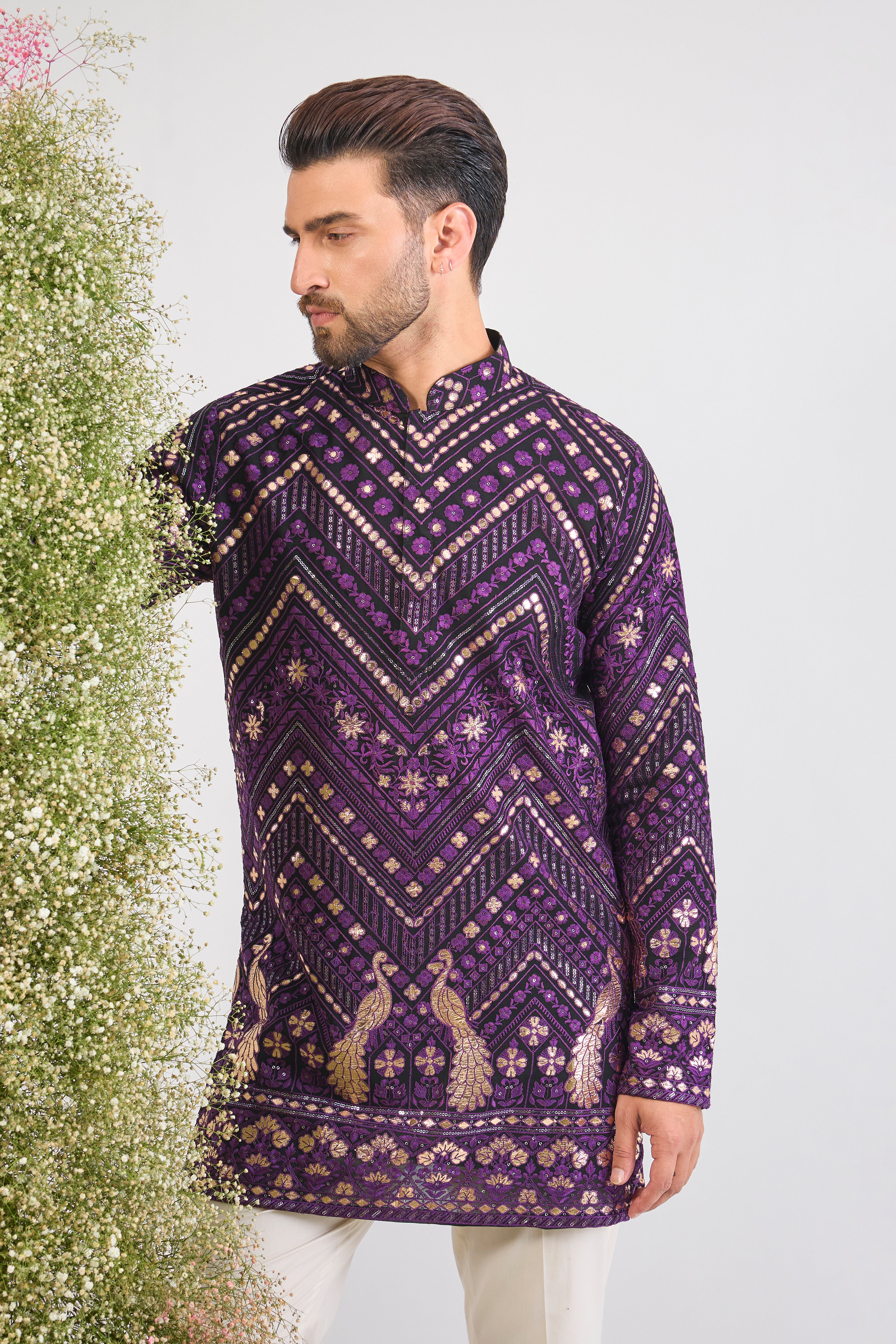 Bold Purple. Bold Texture. Our Short Kurta with Leather Patchwork and Intricate Peacock Motifs is pure artistry. 💜🦚