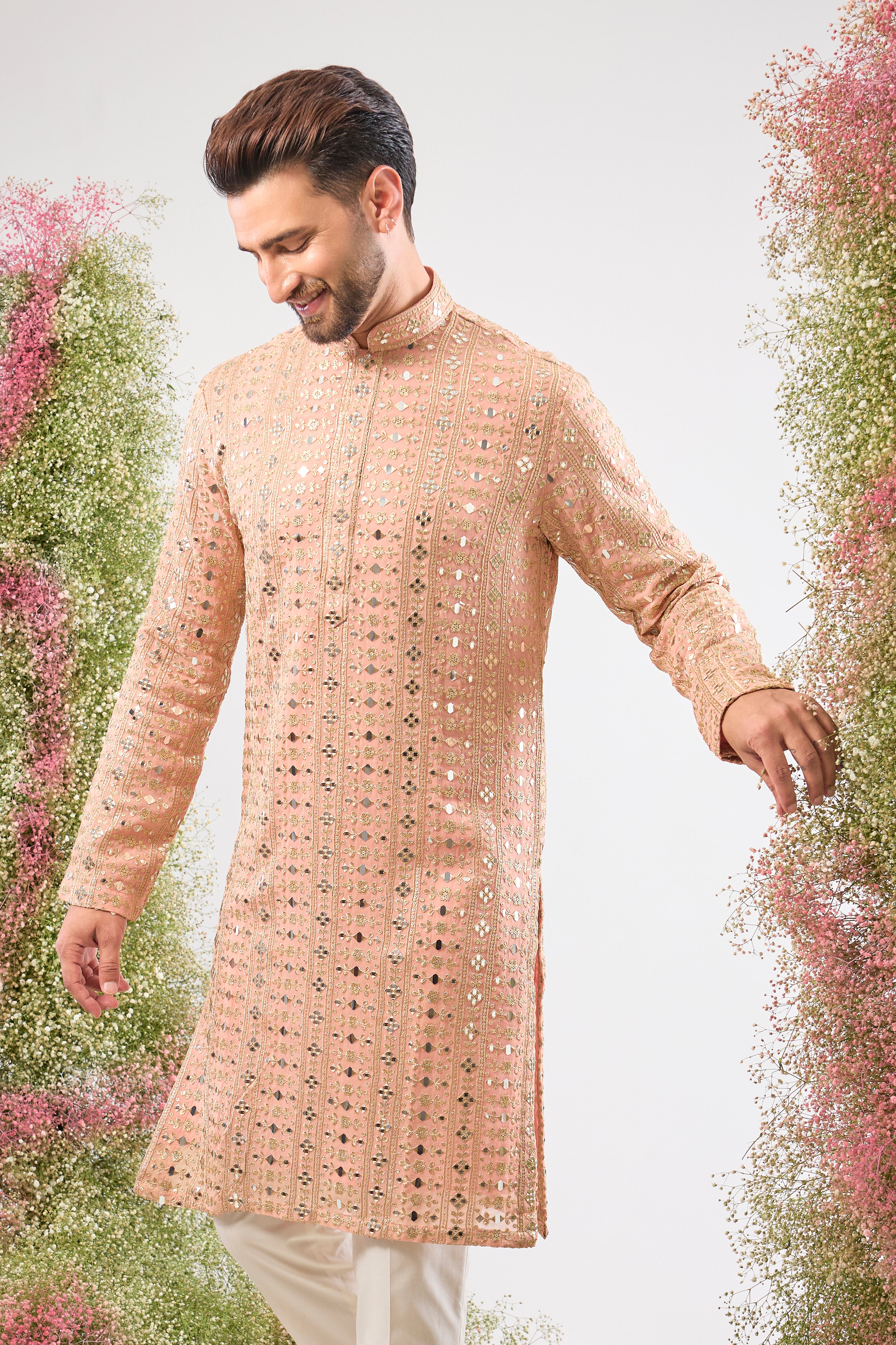 Dazzling peach. Maximum shine. Our Kurta features Heavy Sequin Work that mimics a mirror shine, complemented by Intricate Thread Work. You'll steal the show! 💫