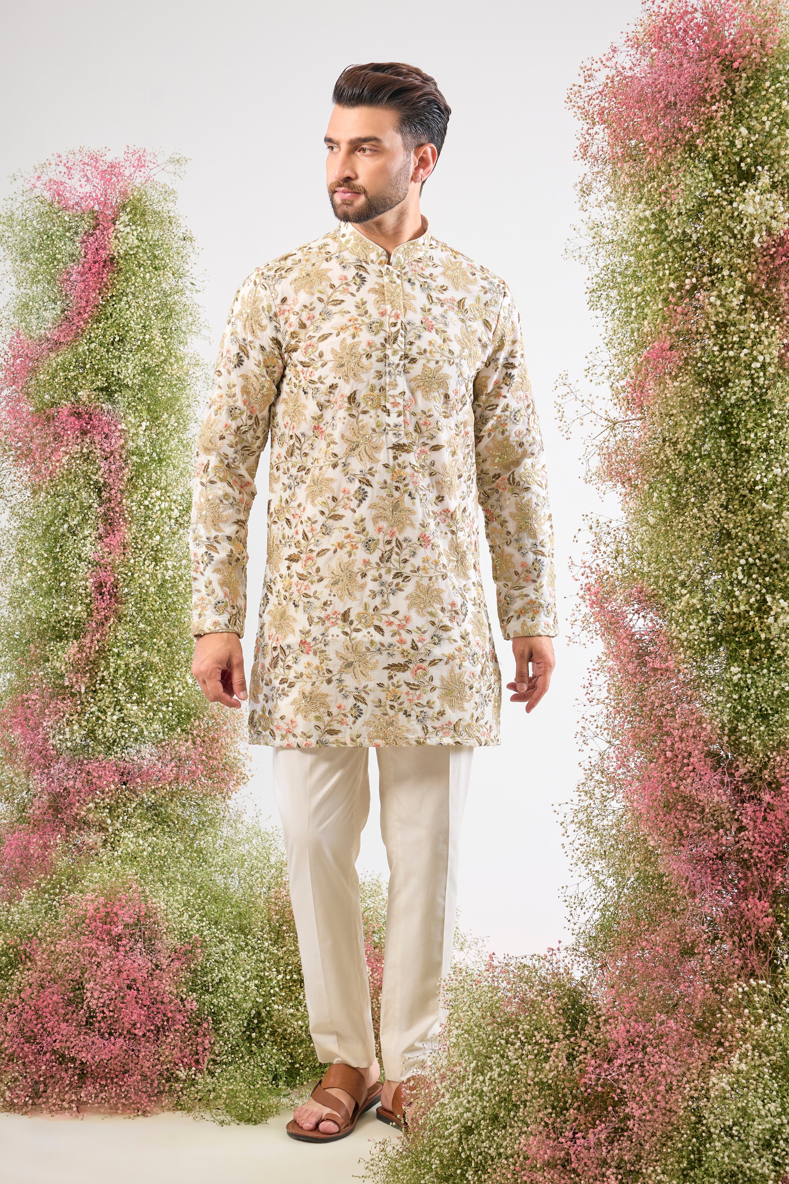 Purity meets precision. This White Short Kurta features dazzling sequins that provide texture and shimmer, while the Detailed Floral Embroidery adds a layer of intricate, handcrafted artistry.