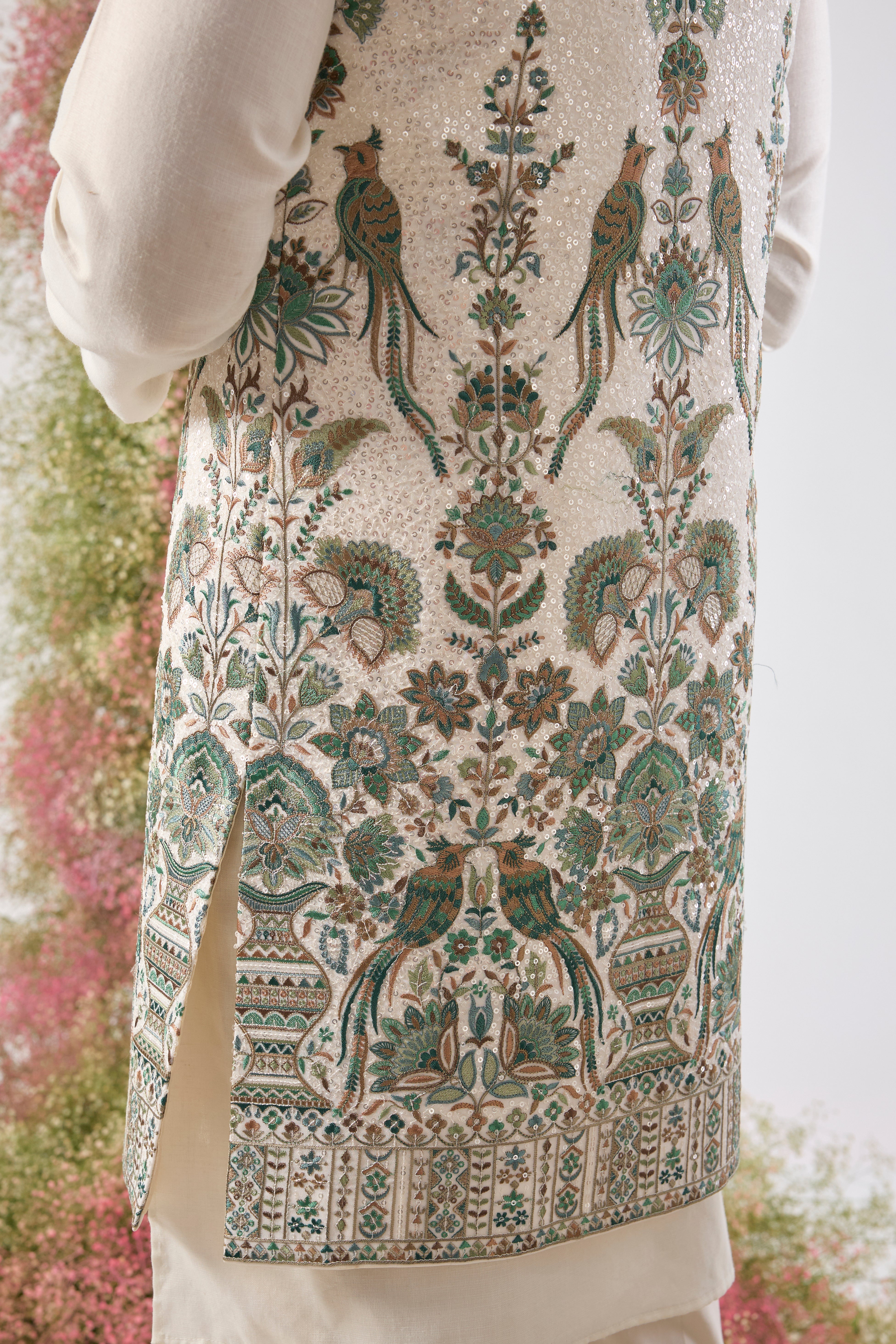 White brilliance. Grand design. Our Long Open Jacket features dazzling sequins and spectacular Detailed Flora and Fauna Embroidery. Simply unforgettable. 🦢