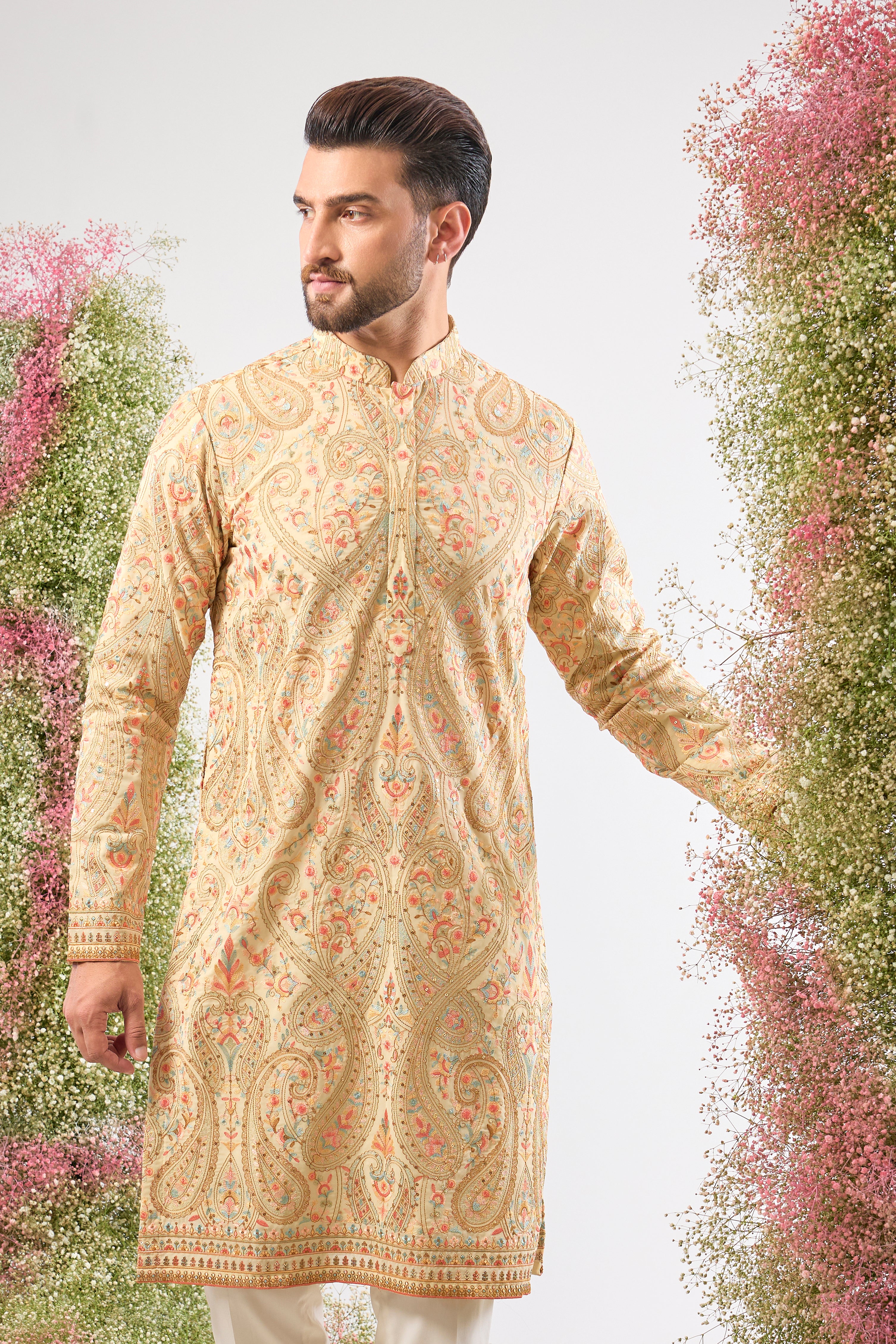 A celebration of thread and texture! This stunning Cream Kurta features exquisite Kashmiri Embroidery using a blend of Intricate Multi-threads. The result is a vibrant, textured pattern that brings depth and life to the classic cream base