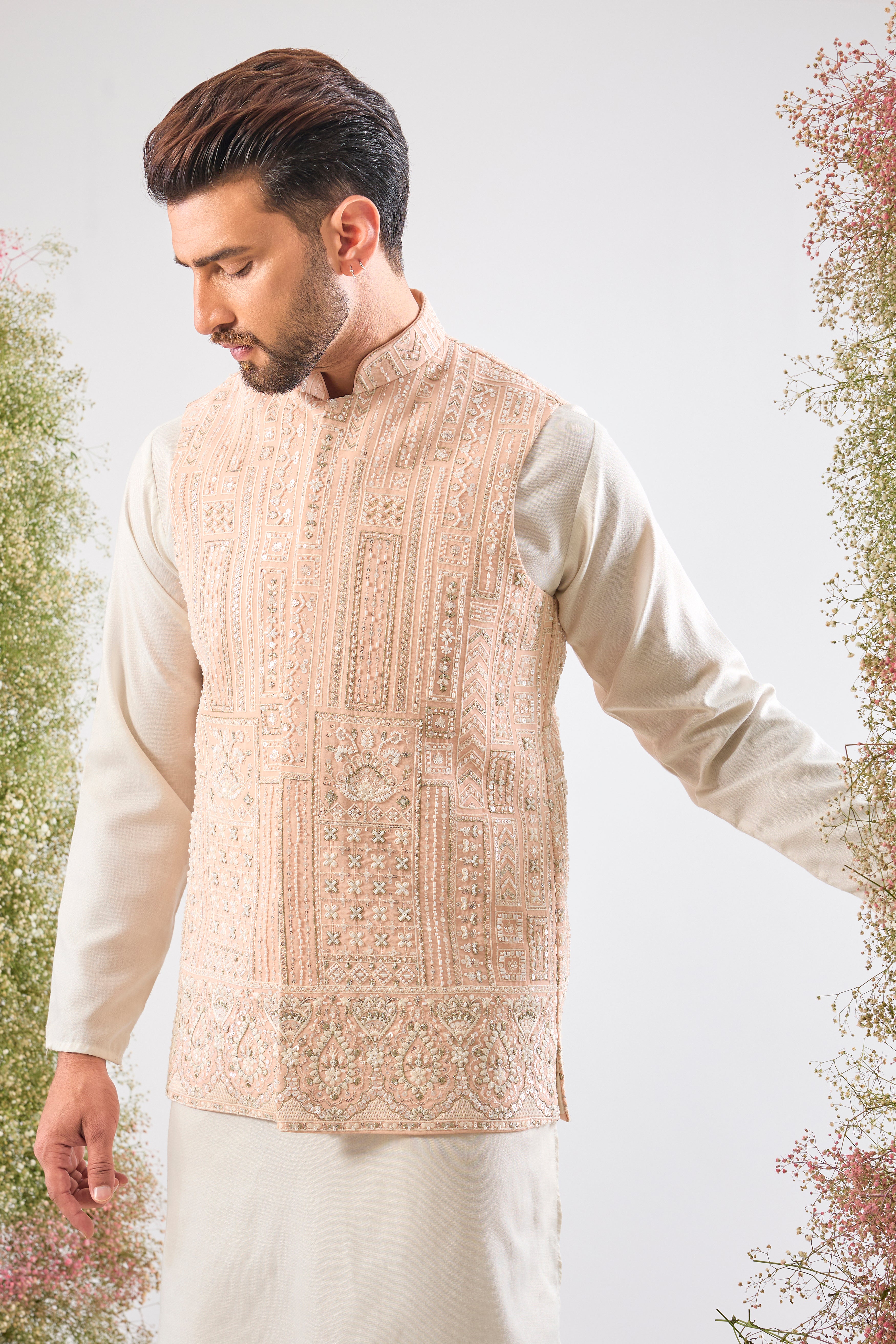 Pink perfection. Our Short Nehru Jacket features beautiful Hand Work with Detailed White Cut Dana and Sequins. Pure elegance.