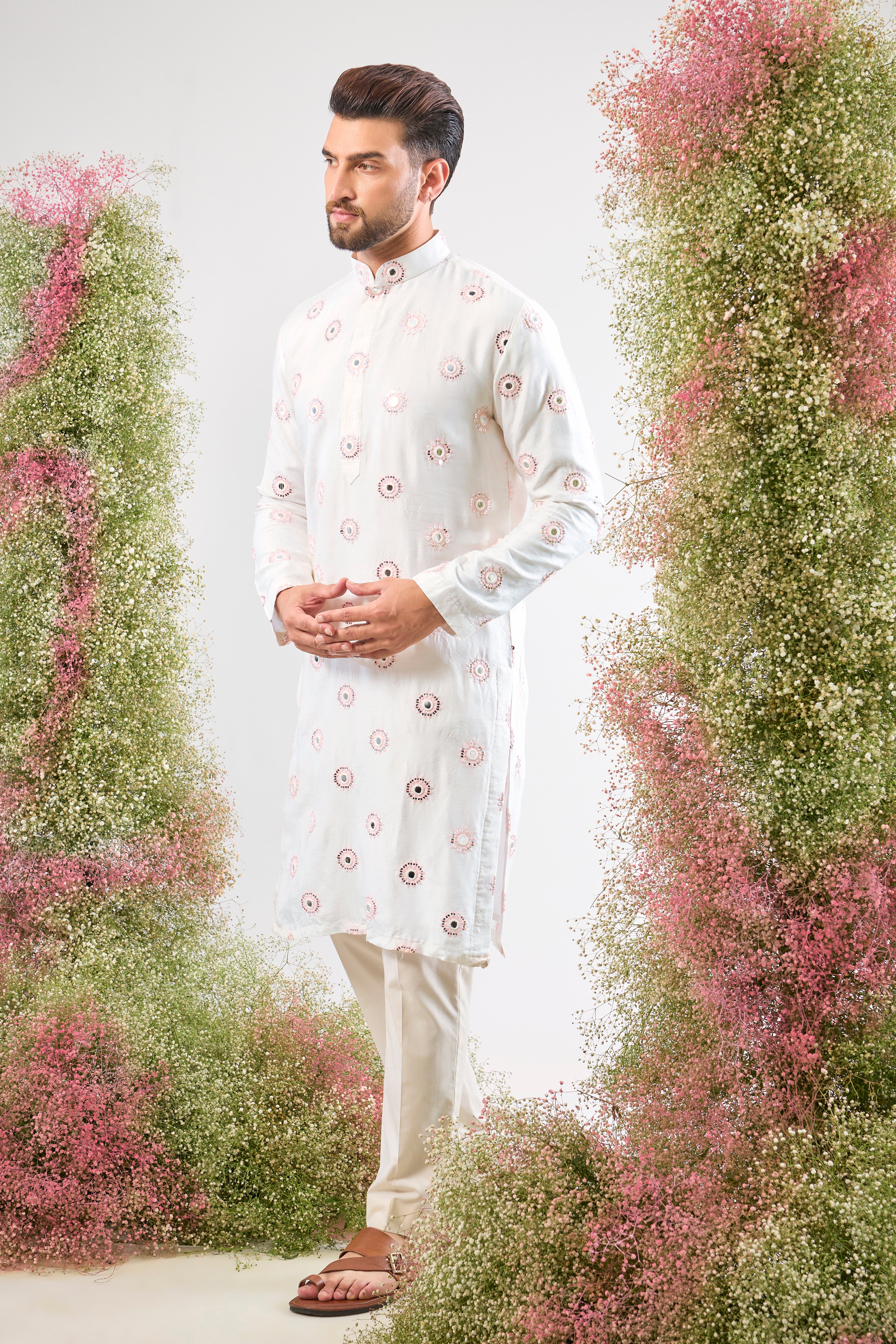 Super classy. Super subtle. Our White Kurta features elegant Powder Pink Thread Work and mirror-effect Sequin Detailing. A look of pure sophistication.