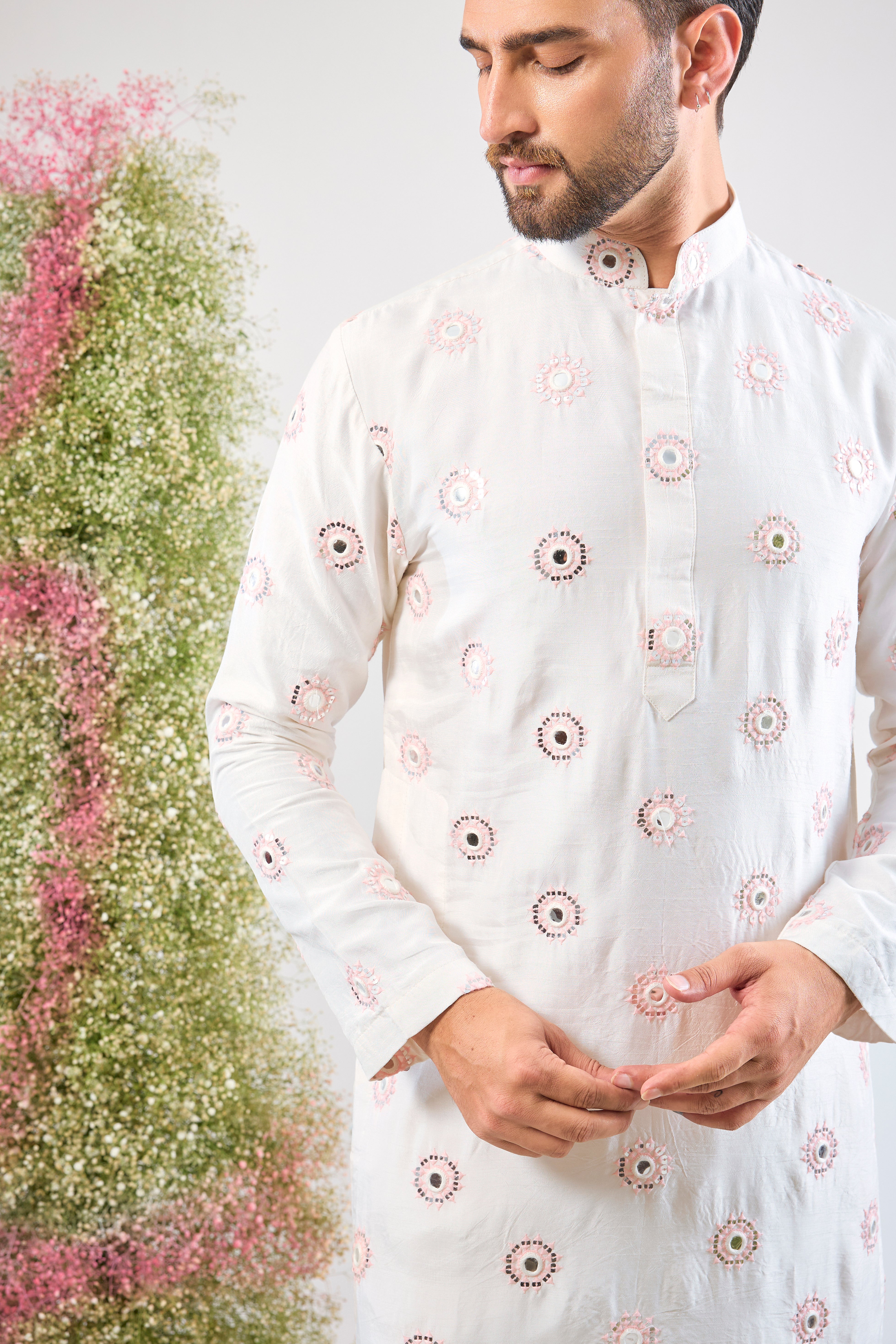 Super classy. Super subtle. Our White Kurta features elegant Powder Pink Thread Work and mirror-effect Sequin Detailing. A look of pure sophistication.