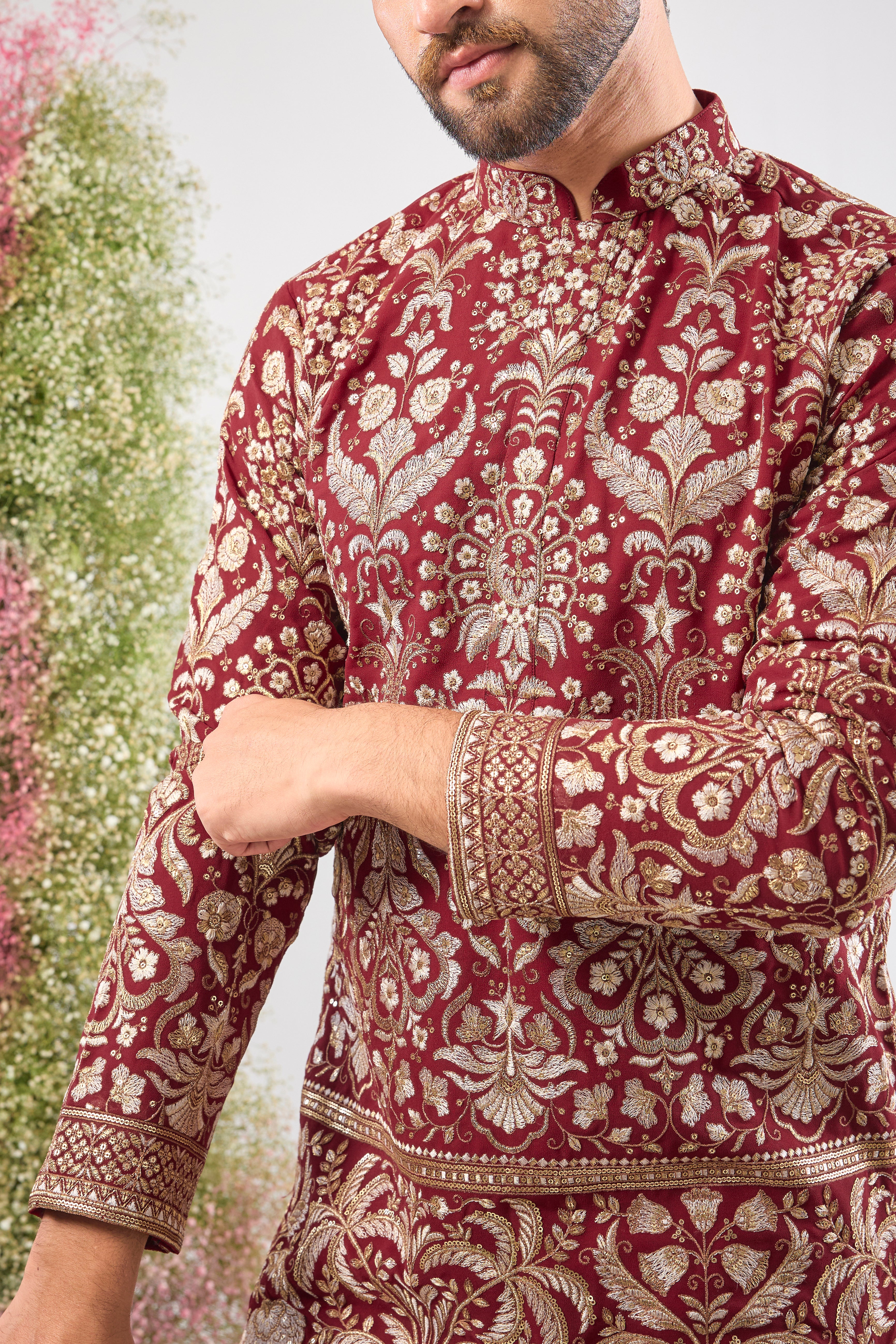 A regal masterpiece in maroon. This Short Kurta showcases magnificent Intricate Heavy Zari and sequin embellishment, achieving a breathtaking texture. The silhouette is perfected with a traditional Heavy Ghera, adding to its imperial feel.