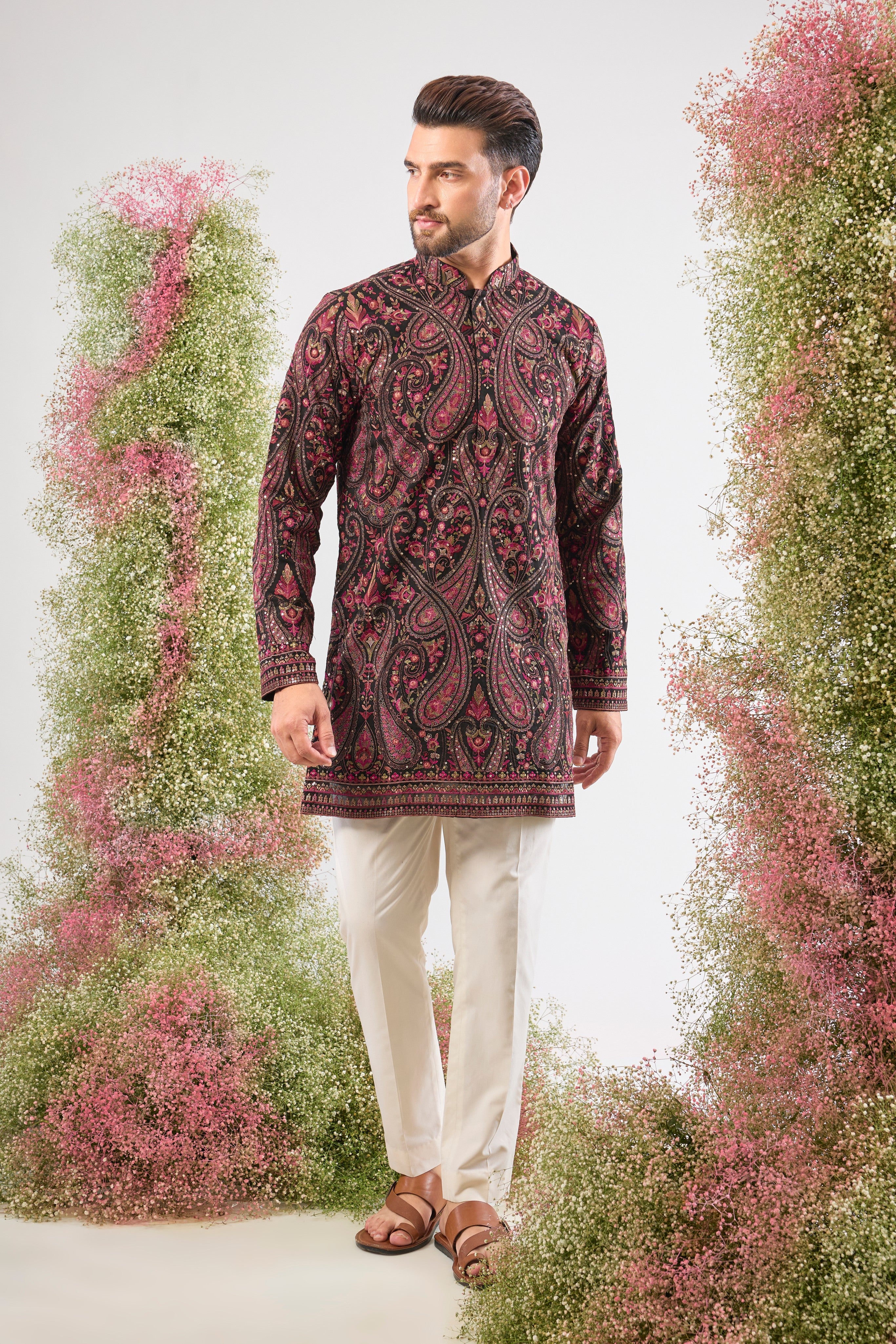 Black brilliance. Rich heritage. This Short Kurta features Detailed Kashmiri Thread Work, a classic Jamawar Pattern, multi-colour threads, and subtle sequins. Absolutely stunning.