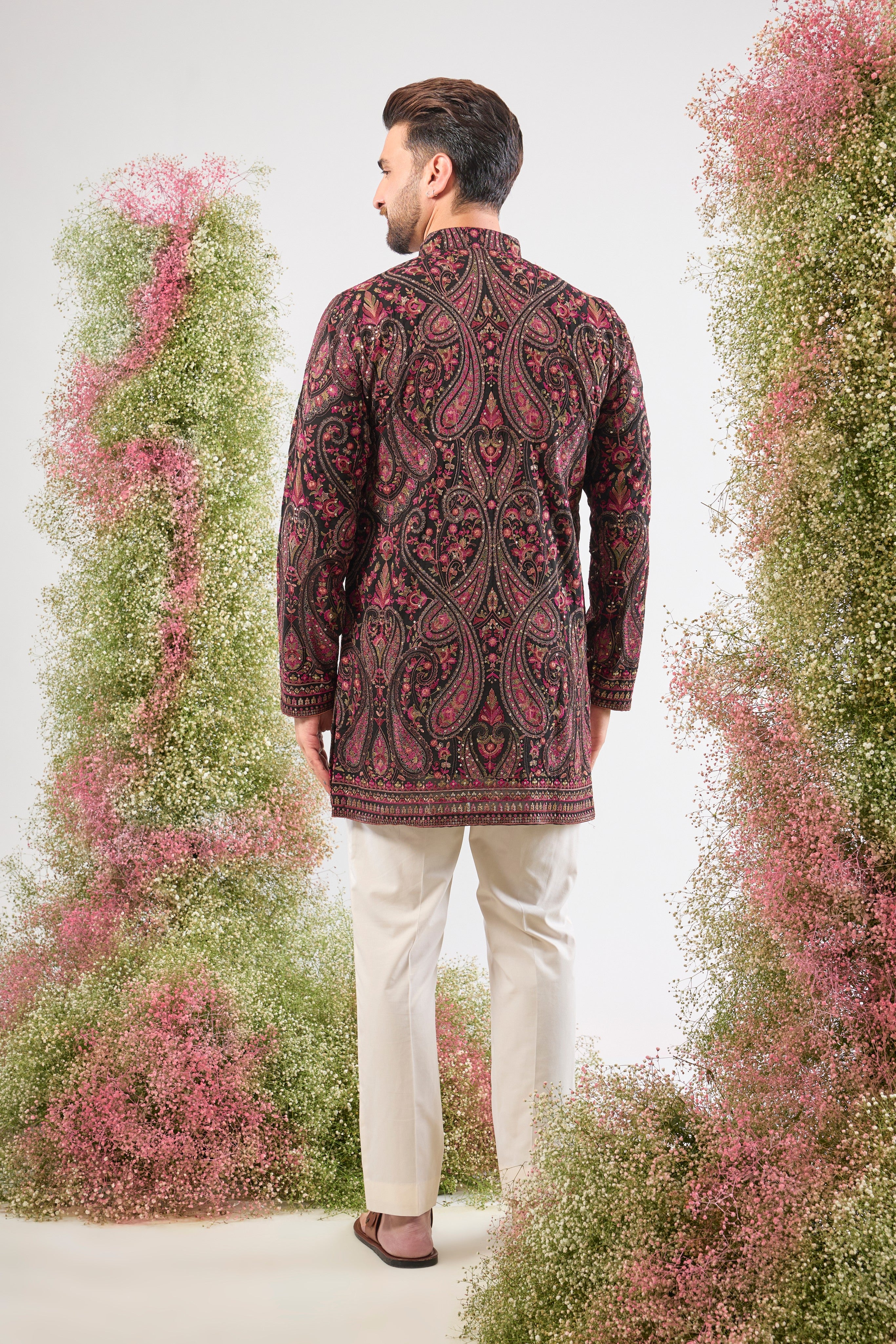 Black brilliance. Rich heritage. This Short Kurta features Detailed Kashmiri Thread Work, a classic Jamawar Pattern, multi-colour threads, and subtle sequins. Absolutely stunning.