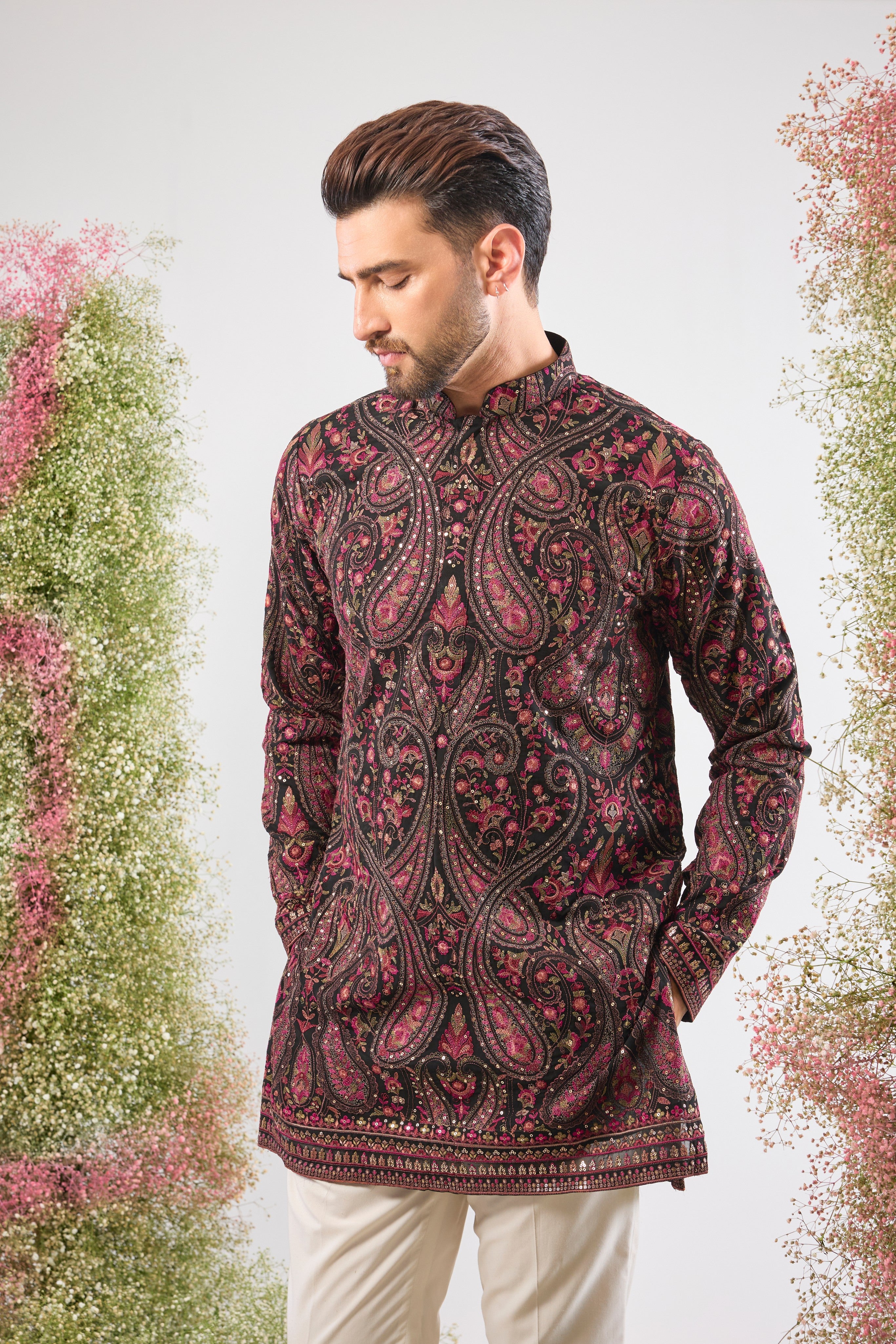 Black brilliance. Rich heritage. This Short Kurta features Detailed Kashmiri Thread Work, a classic Jamawar Pattern, multi-colour threads, and subtle sequins. Absolutely stunning.