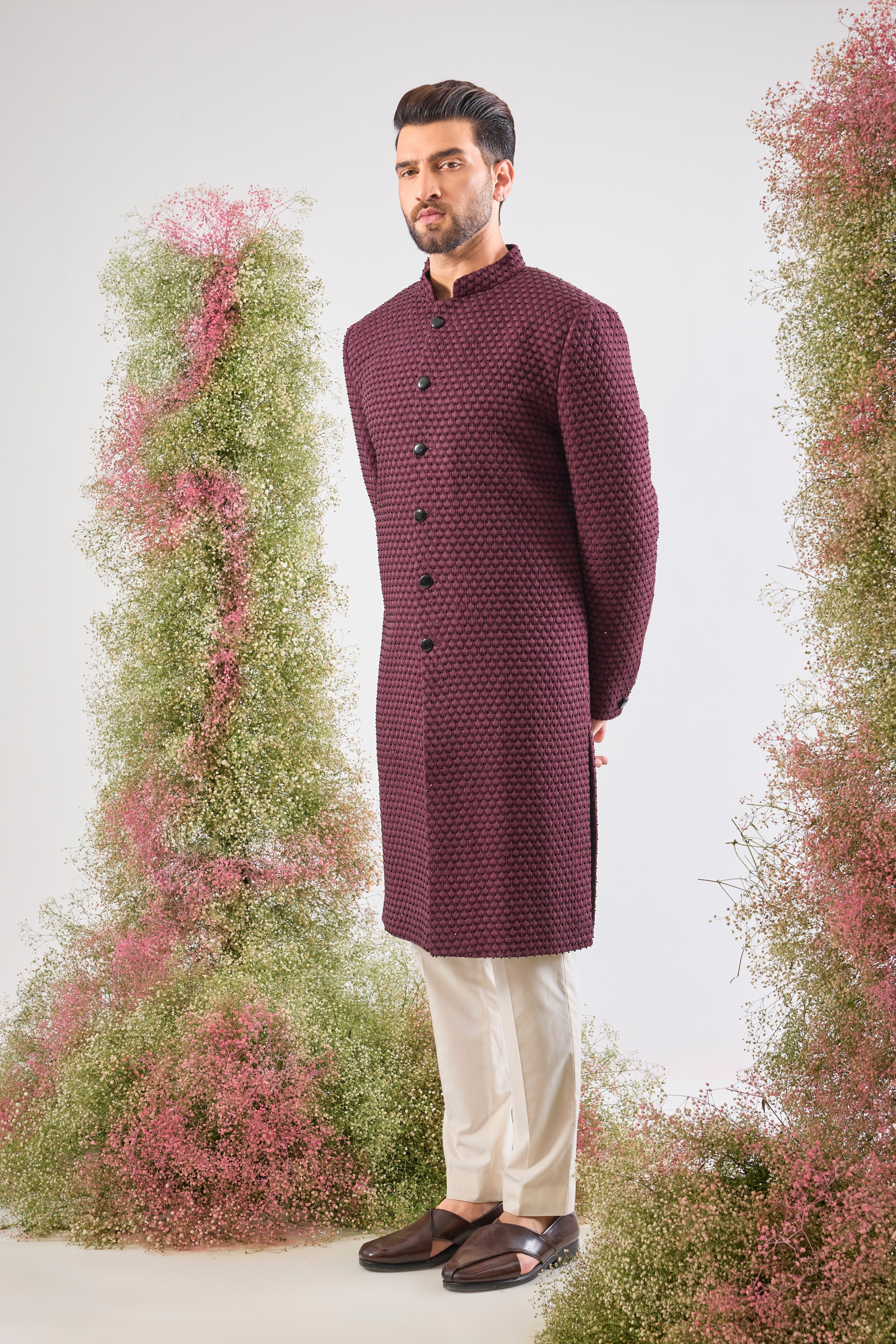 This Sherwani showcases beautiful Detailed Tone-to-Tone Thread Work, creating depth and richness on the fabric. The subtle, yet dramatic contrast of Black Cut Dana elevates the design, lending it a contemporary edge.