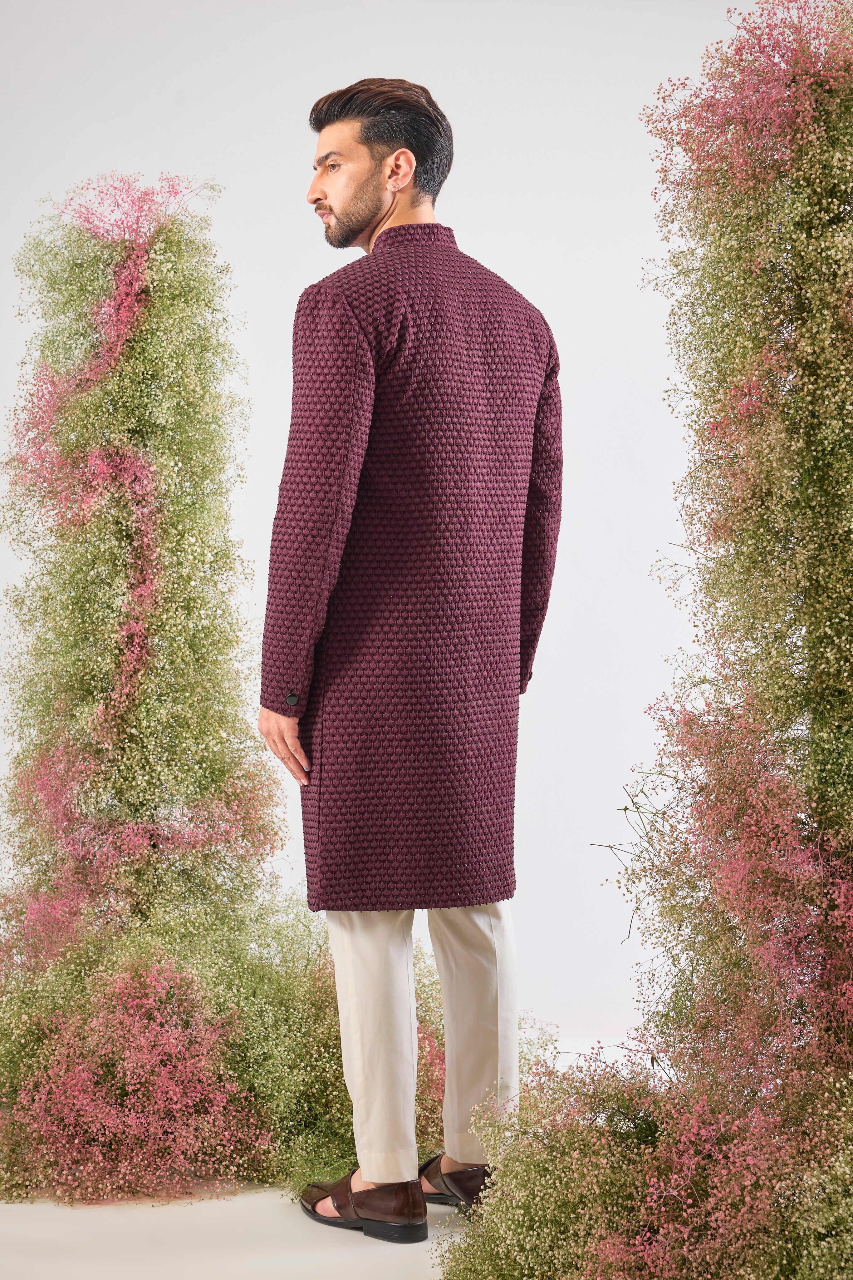 This Sherwani showcases beautiful Detailed Tone-to-Tone Thread Work, creating depth and richness on the fabric. The subtle, yet dramatic contrast of Black Cut Dana elevates the design, lending it a contemporary edge.