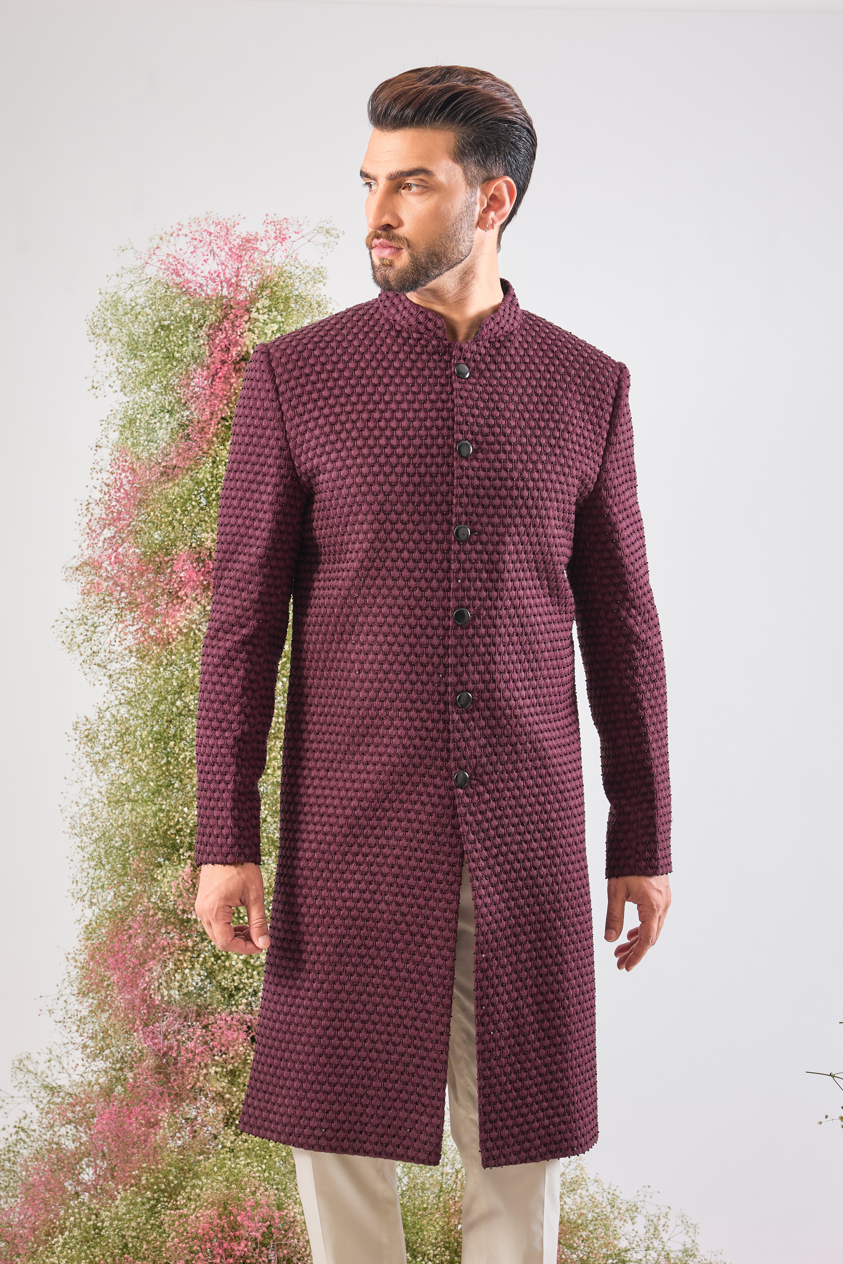 This Sherwani showcases beautiful Detailed Tone-to-Tone Thread Work, creating depth and richness on the fabric. The subtle, yet dramatic contrast of Black Cut Dana elevates the design, lending it a contemporary edge.