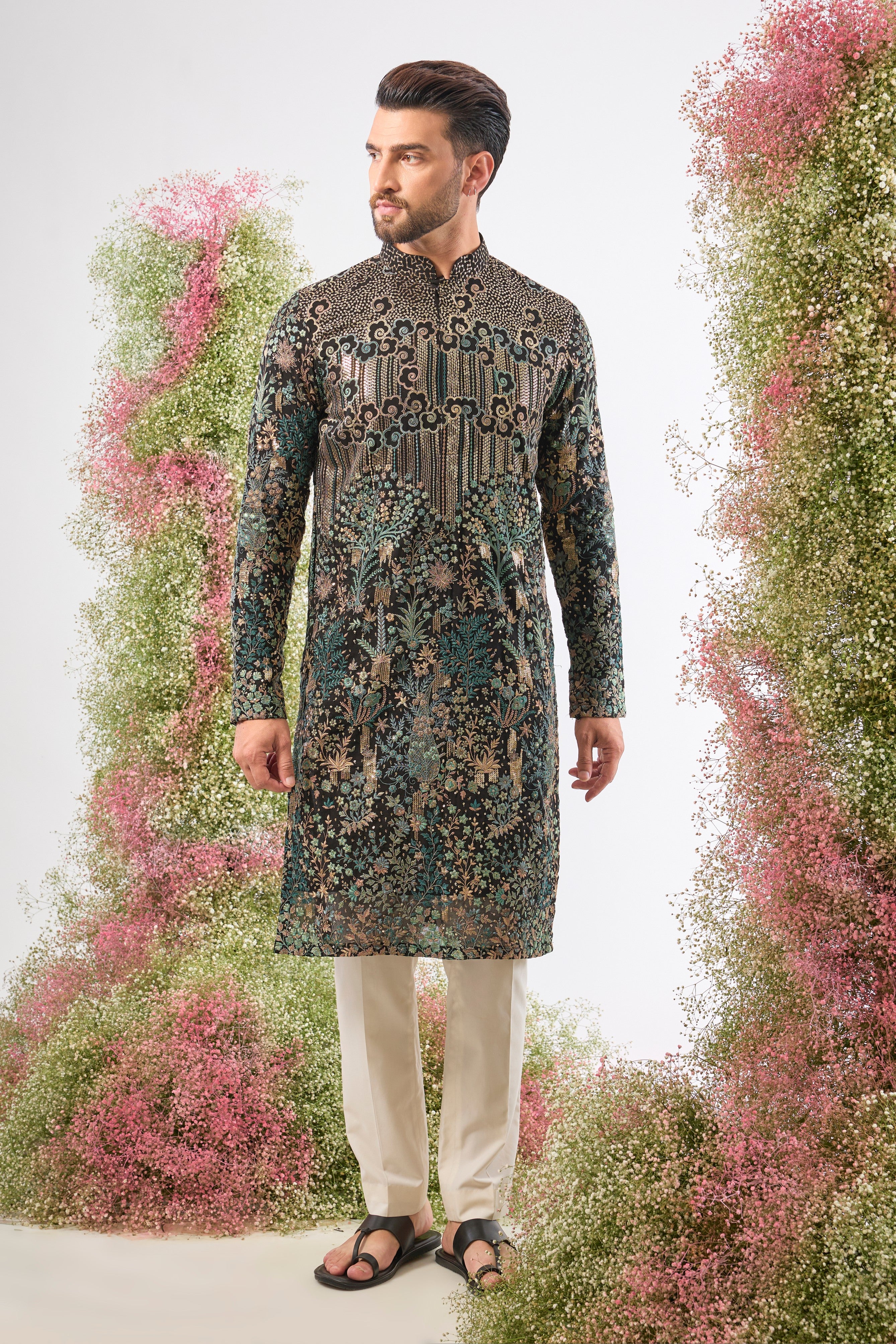 Wear a piece of dark art. This breathtaking Black Kurta features a Detailed Floral Tropical Era design, showcasing intricate artistry in Green and Black Threadwork.