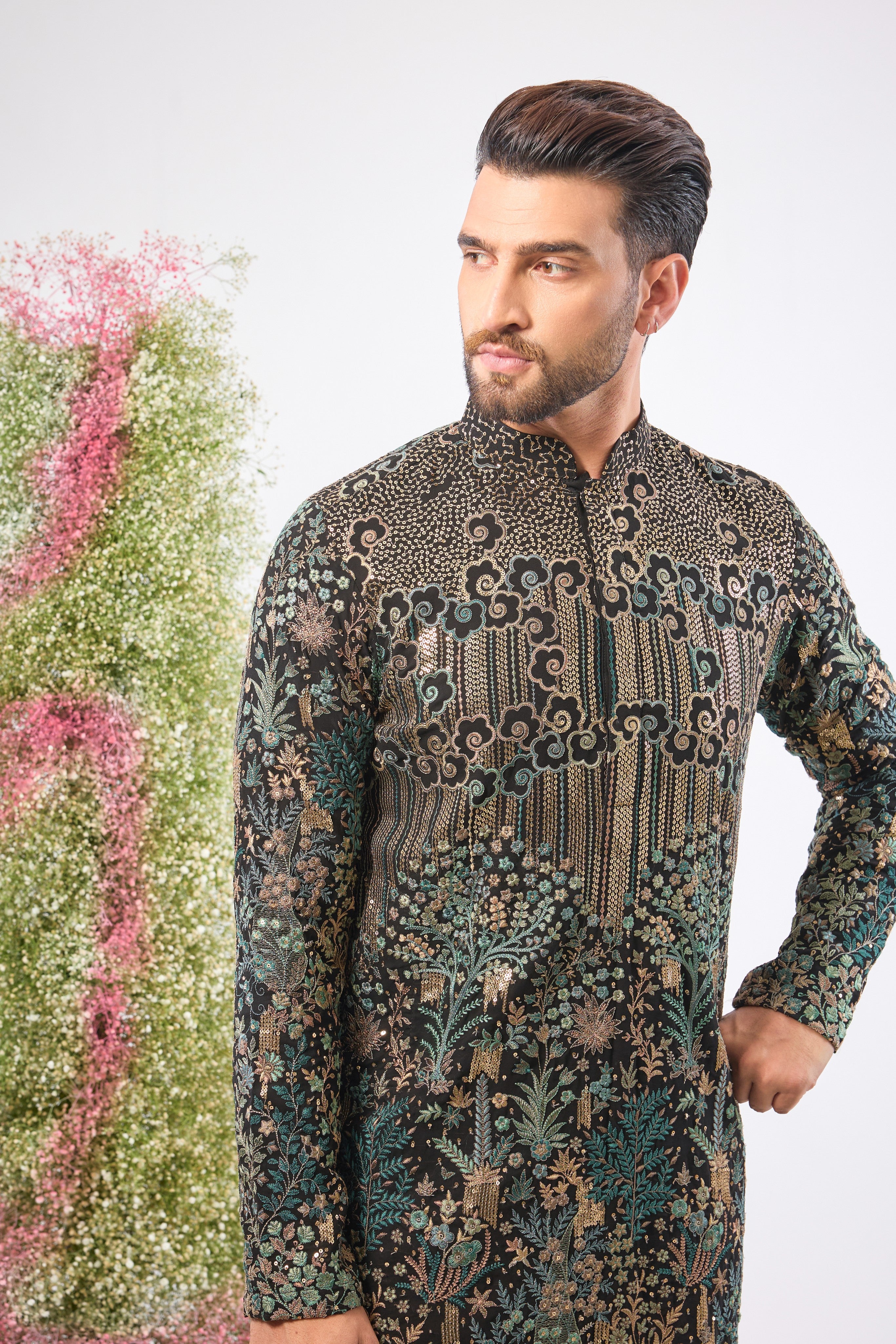 Wear a piece of dark art. This breathtaking Black Kurta features a Detailed Floral Tropical Era design, showcasing intricate artistry in Green and Black Threadwork.