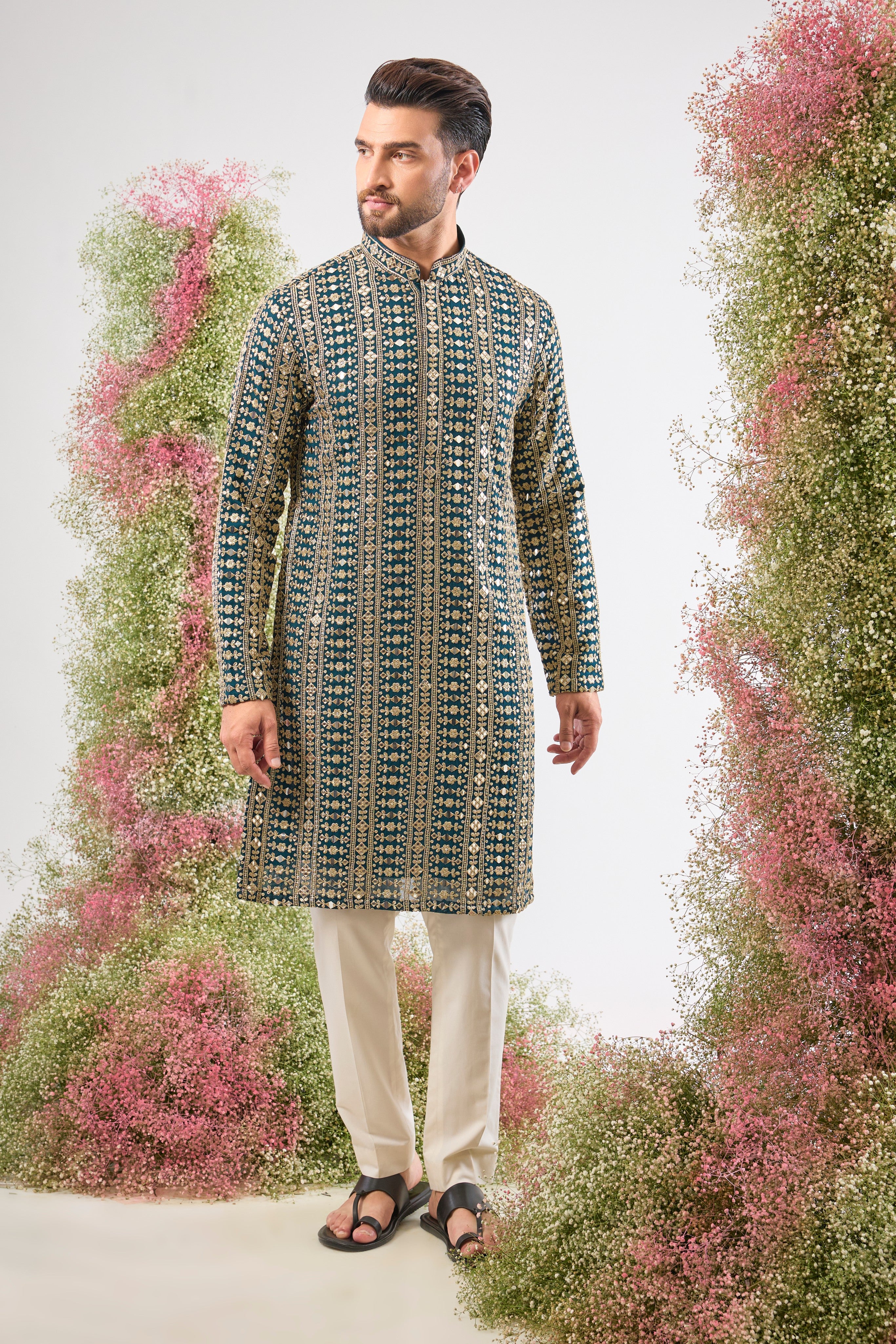 This Mirror Work Kurta showcases the grandeur of Heavy Zari and Sequin Work, providing unmatched brilliance and texture. The stunning colour and dense handwork create an aura of sophisticated festive luxury.