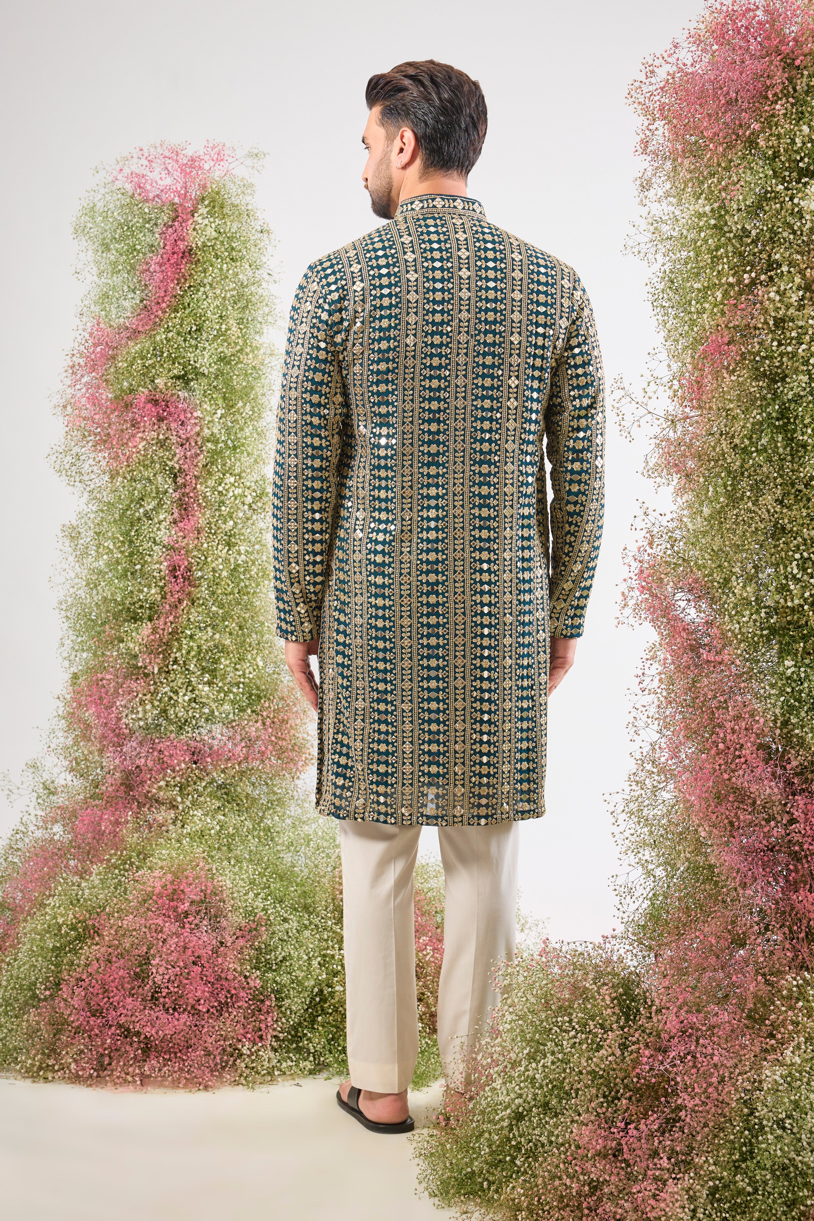 This Mirror Work Kurta showcases the grandeur of Heavy Zari and Sequin Work, providing unmatched brilliance and texture. The stunning colour and dense handwork create an aura of sophisticated festive luxury.