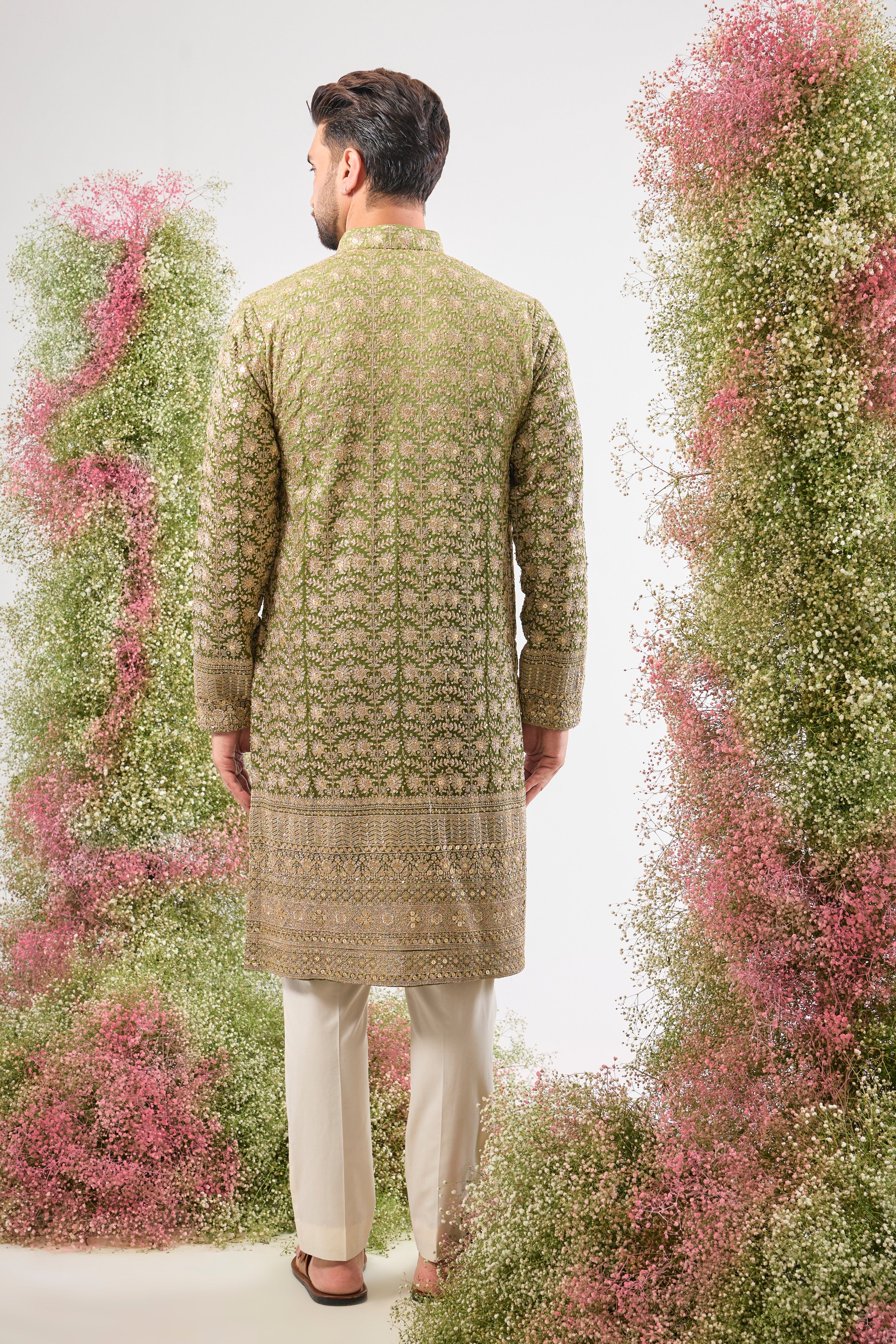 This Ombre Shaded Kurta showcases the richness of Intricate Zari and Sequin Work, perfectly complemented by a beautifully Detailed Ghera. The gradient and embellishment create an unparalleled sense of movement and luxury.