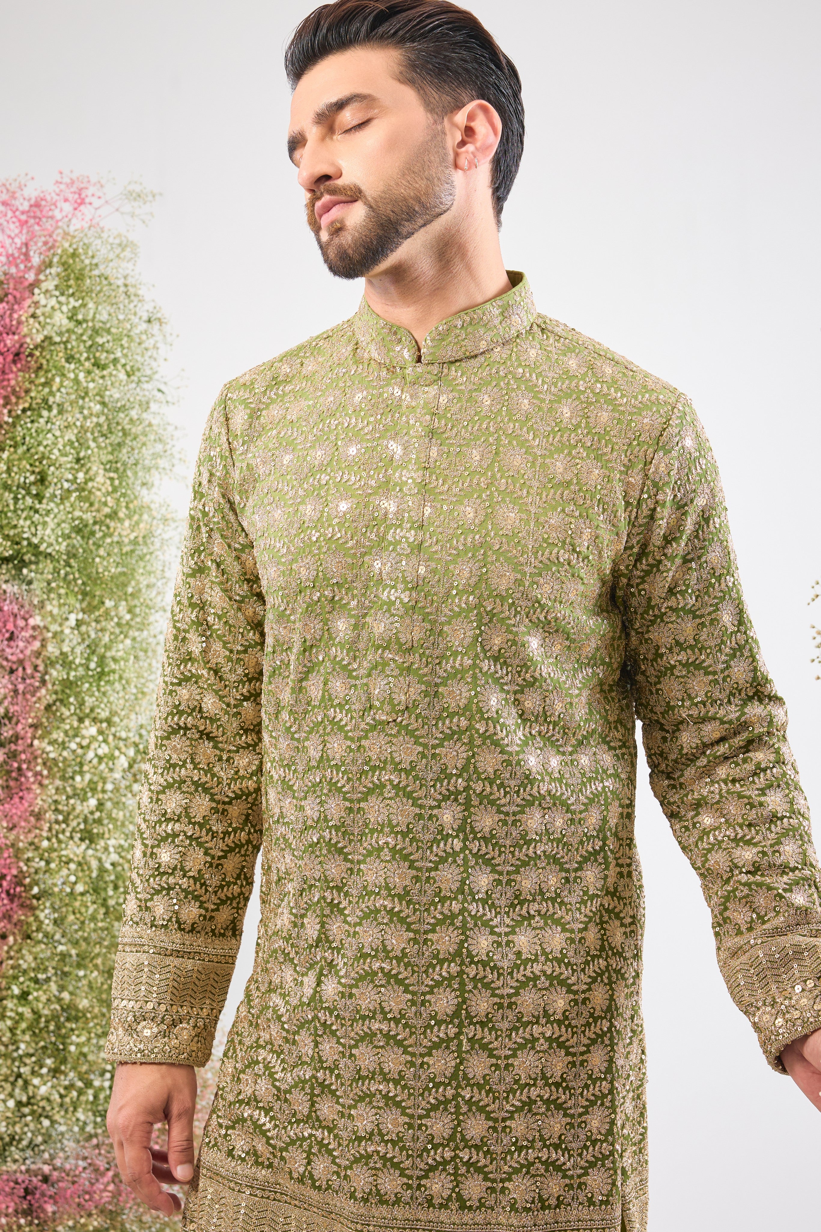 This Ombre Shaded Kurta showcases the richness of Intricate Zari and Sequin Work, perfectly complemented by a beautifully Detailed Ghera. The gradient and embellishment create an unparalleled sense of movement and luxury.