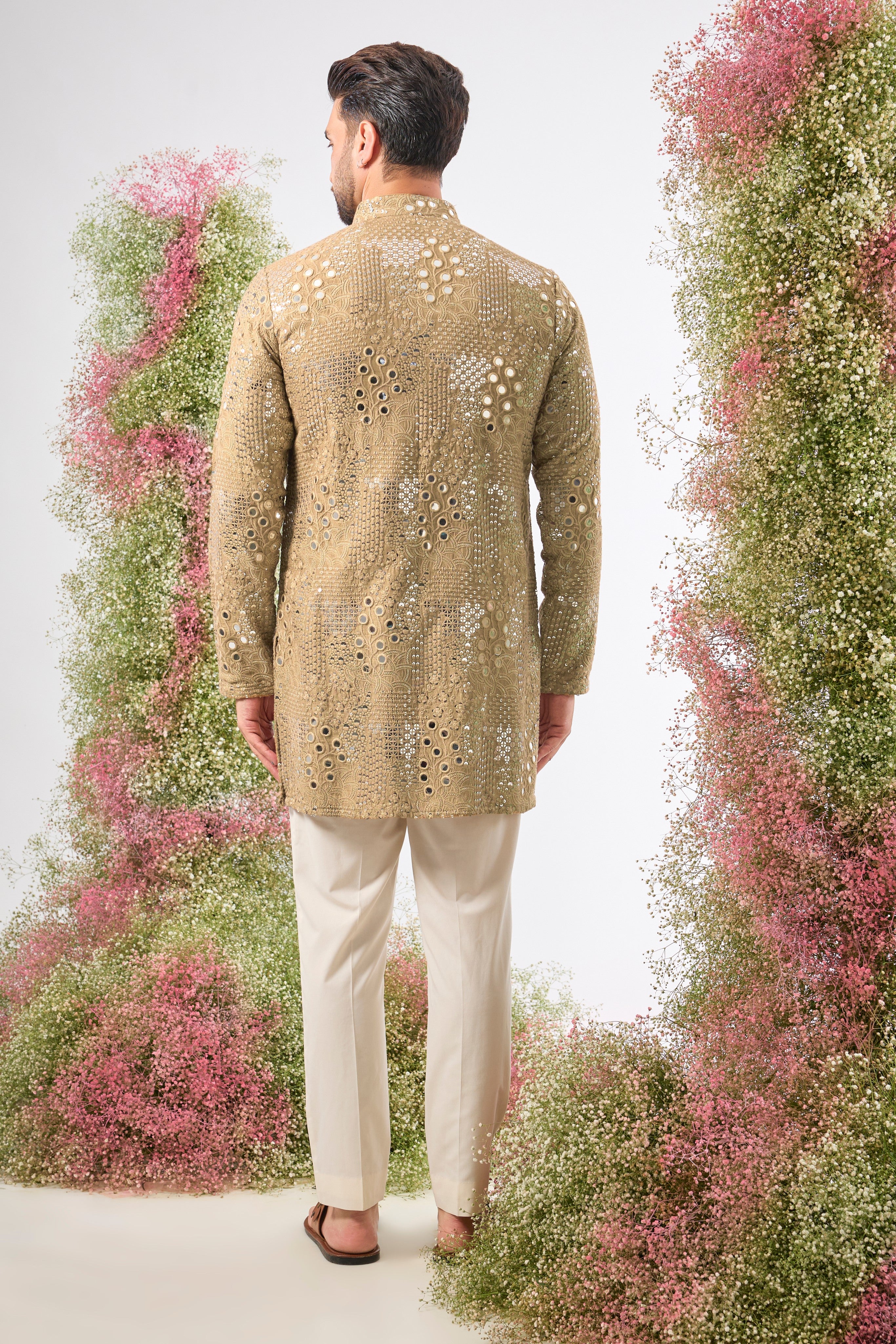 This Copper- brown Mirror Work Kurta showcases exquisite Intricate Floral Patterns, beautifully highlighted by the reflective Sequin Work. The combination creates depth and a continuous, captivating shimmer.