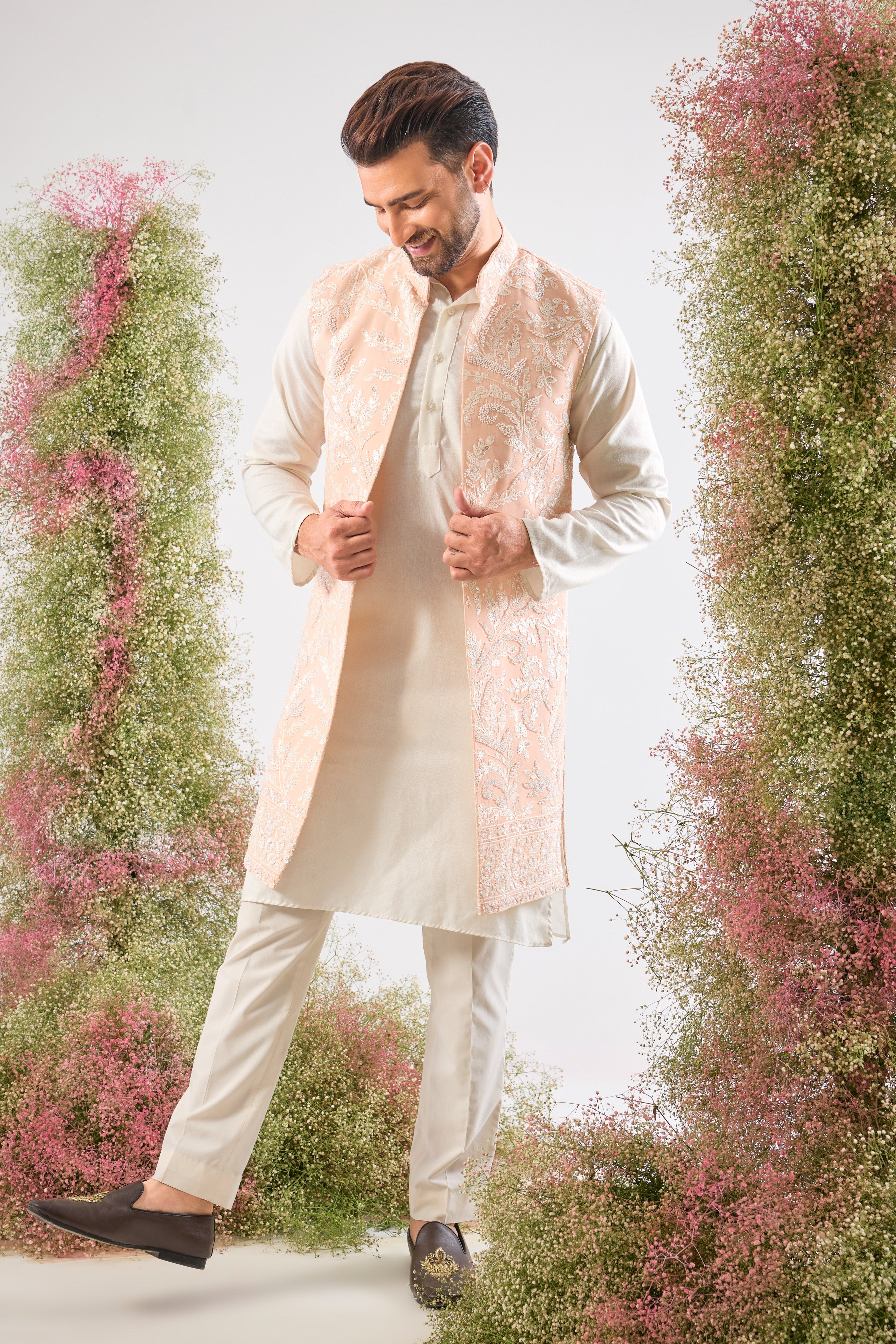 Handcrafted perfection. Our Long Open Jacket features detailed Hind Hand Work, luminous White Cut Dana, sequins, and a delicate Floral Pattern. Pure elegance.