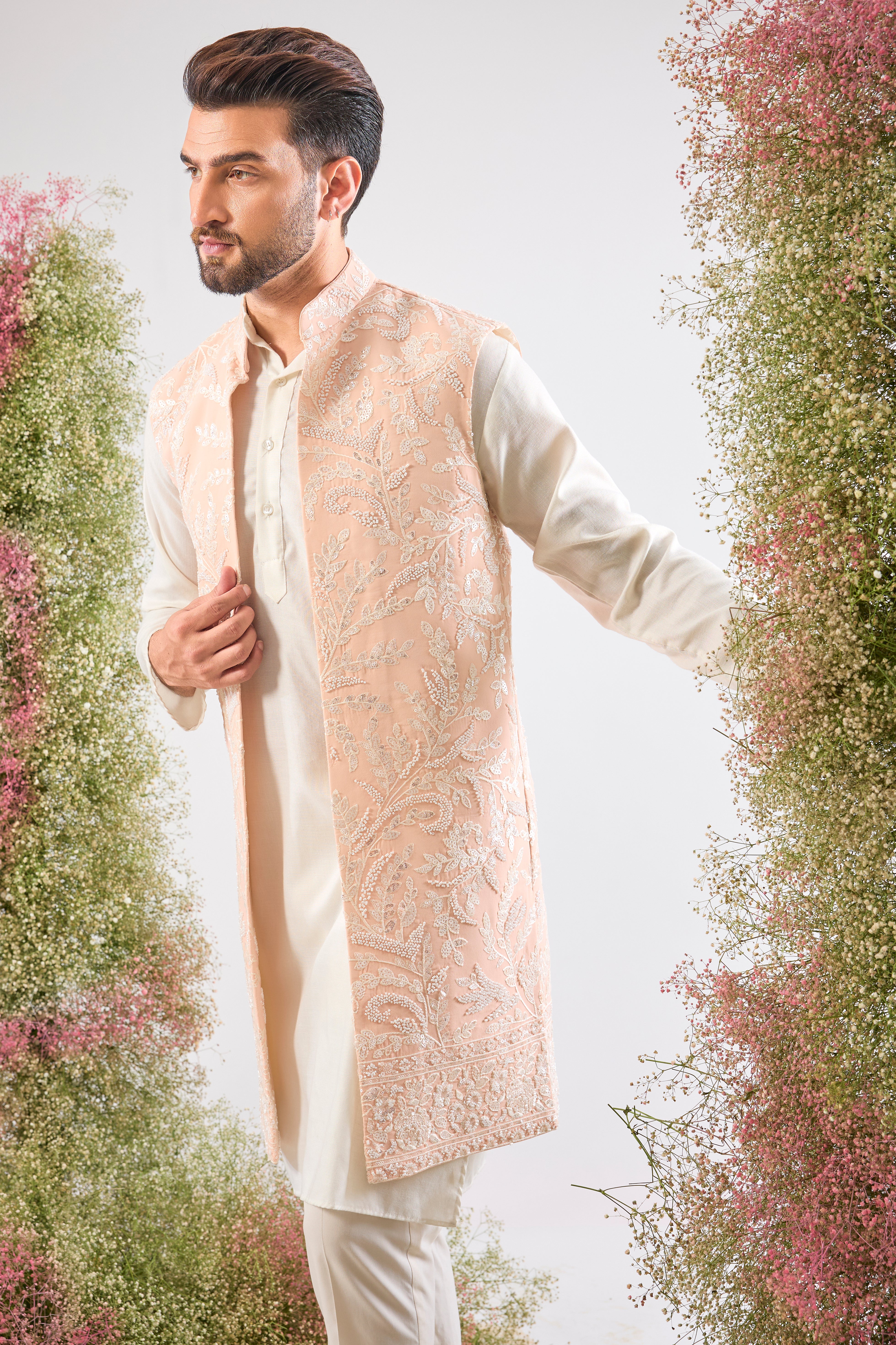 Handcrafted perfection. Our Long Open Jacket features detailed Hind Hand Work, luminous White Cut Dana, sequins, and a delicate Floral Pattern. Pure elegance.