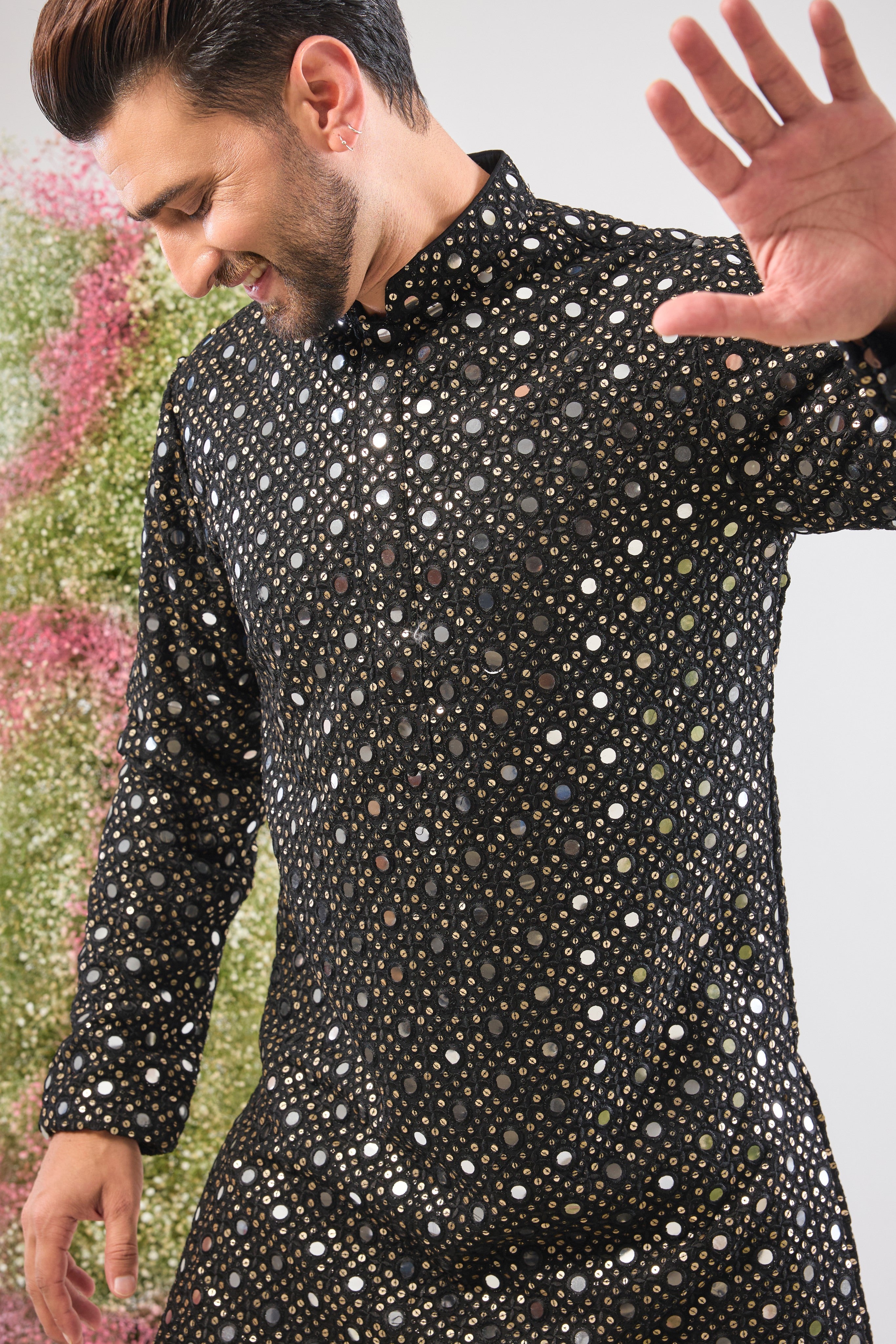 This Short Mirror Work Kurta showcases the richness of a dark base illuminated by continuous, Heavy Sequin Work. The dense sequin coverage ensures a luminous, unforgettable texture, making it the definition of sophisticated party wear.