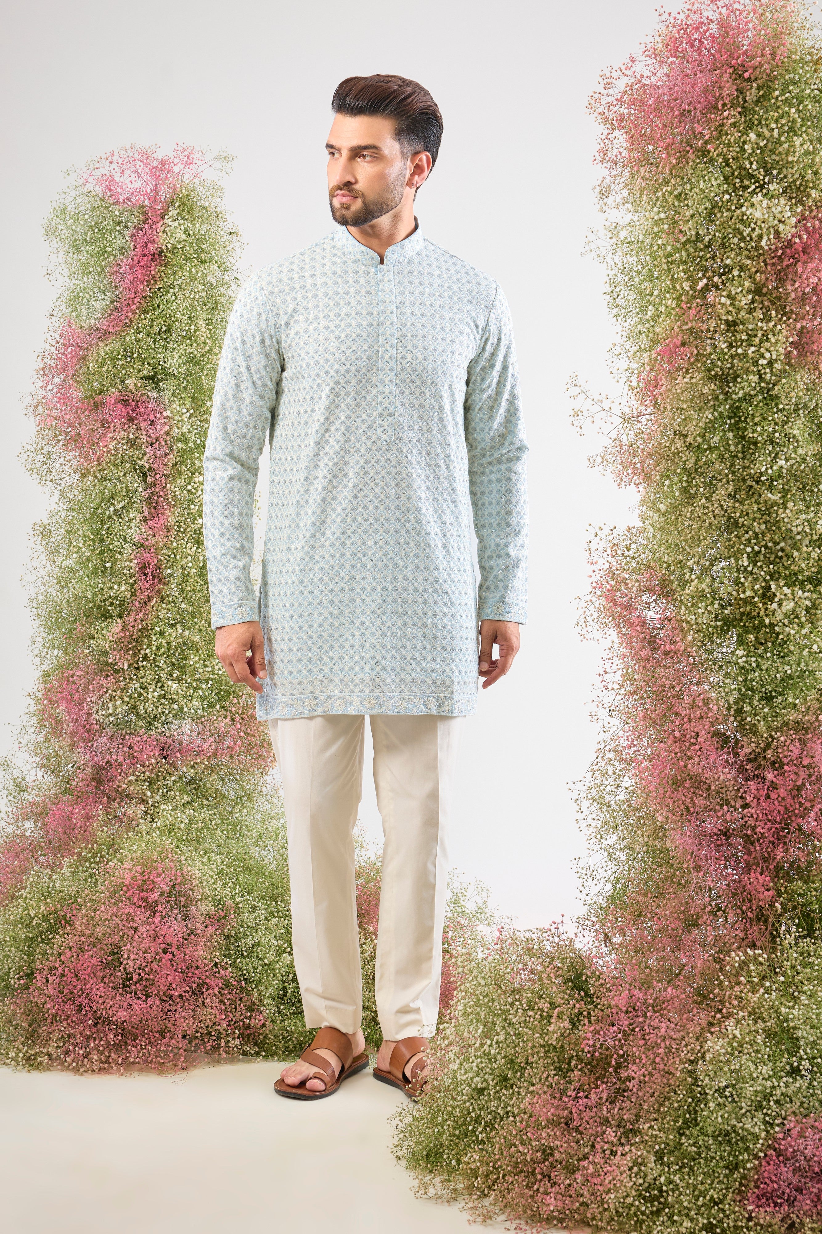A delicate balance of tradition and dazzle: This Blue Chikankari Short Kurta features exquisite hand-stitched patterns in Cream Thread Work