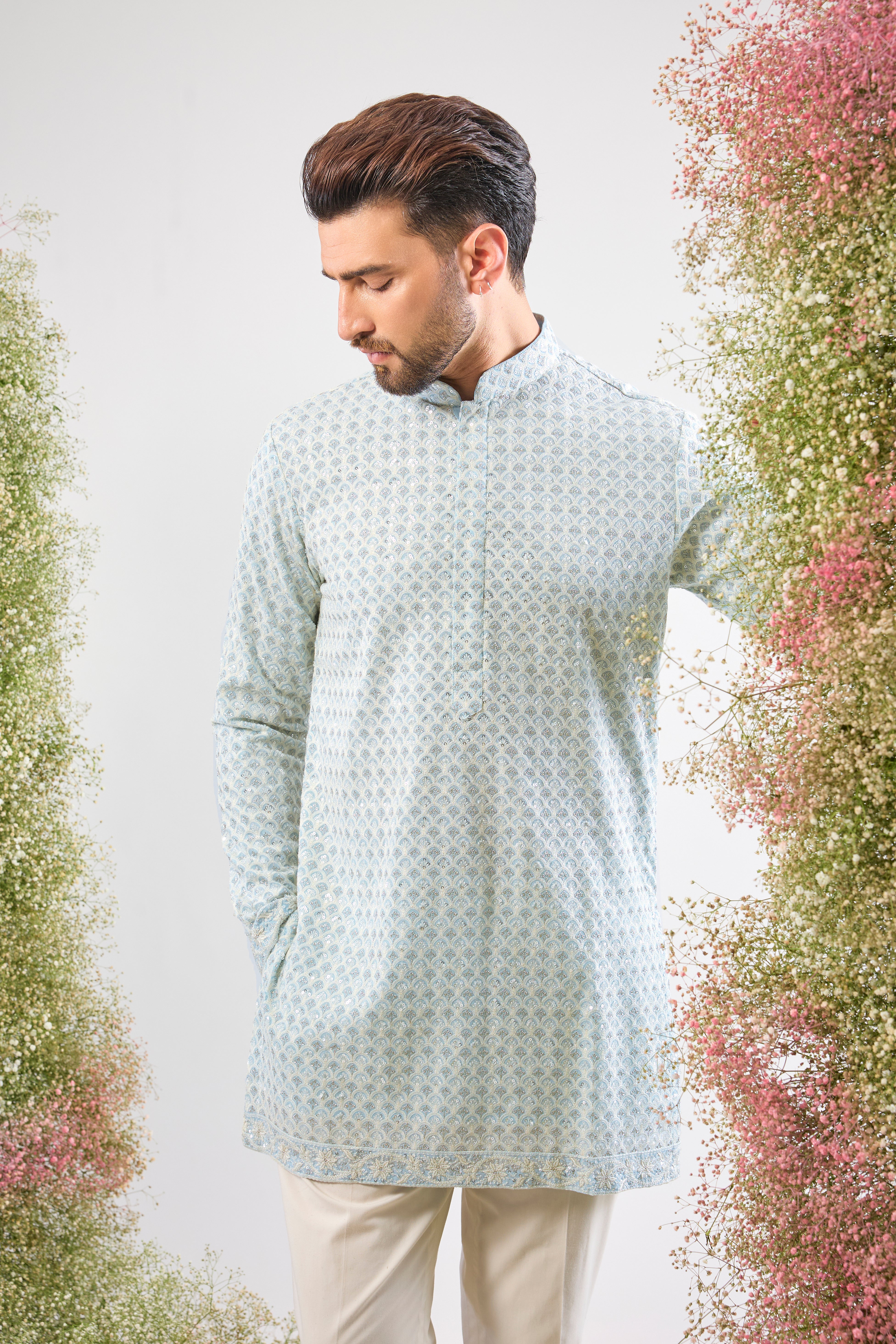 A delicate balance of tradition and dazzle: This Blue Chikankari Short Kurta features exquisite hand-stitched patterns in Cream Thread Work