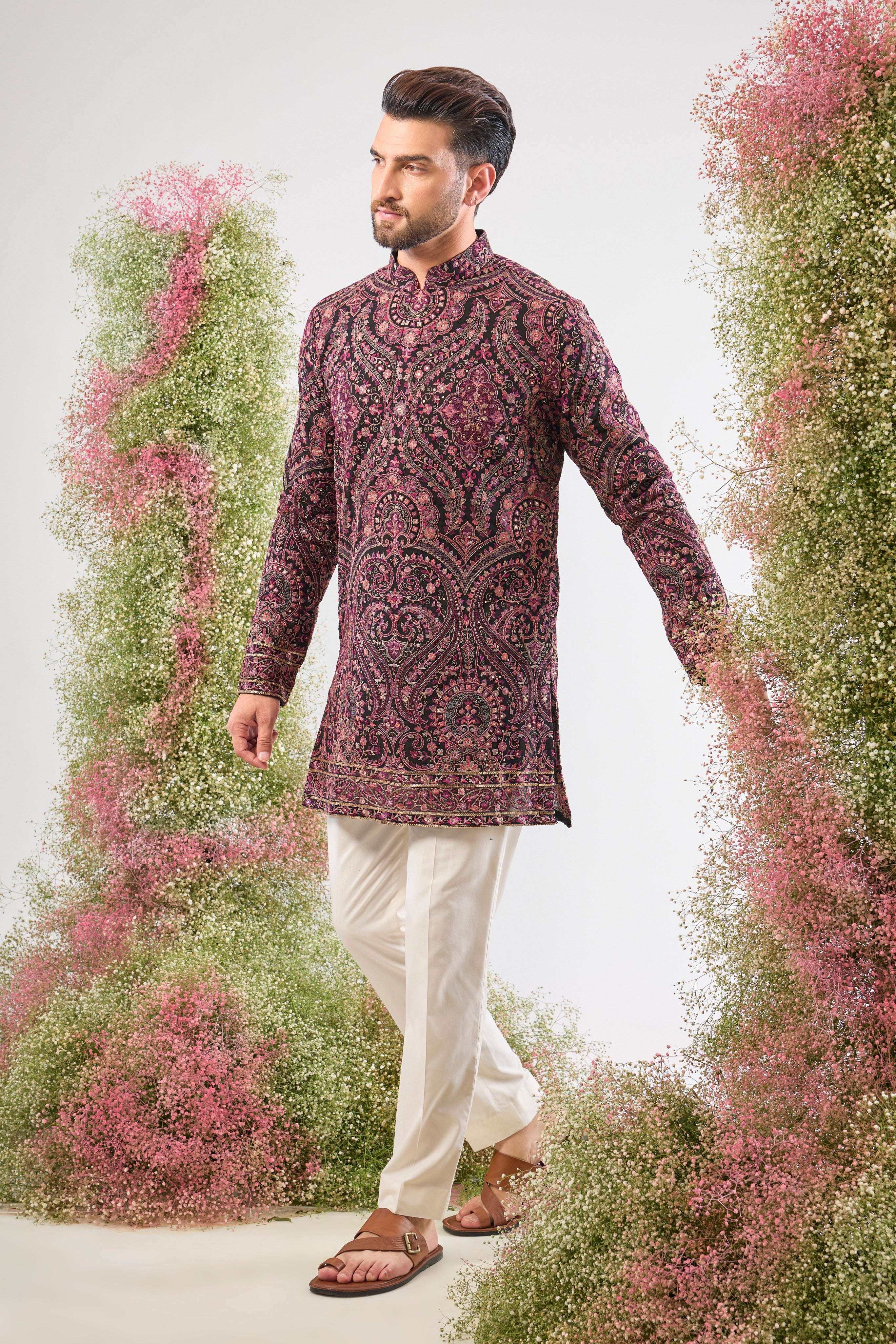 This Black Short Kurta showcases a stunning Jamawar Pattern executed in exquisite, Detailed Multi-threadwork Kashmiri Embroidery. The complex texture and rich detailing make this piece a magnificent fusion of heritage and high fashion.