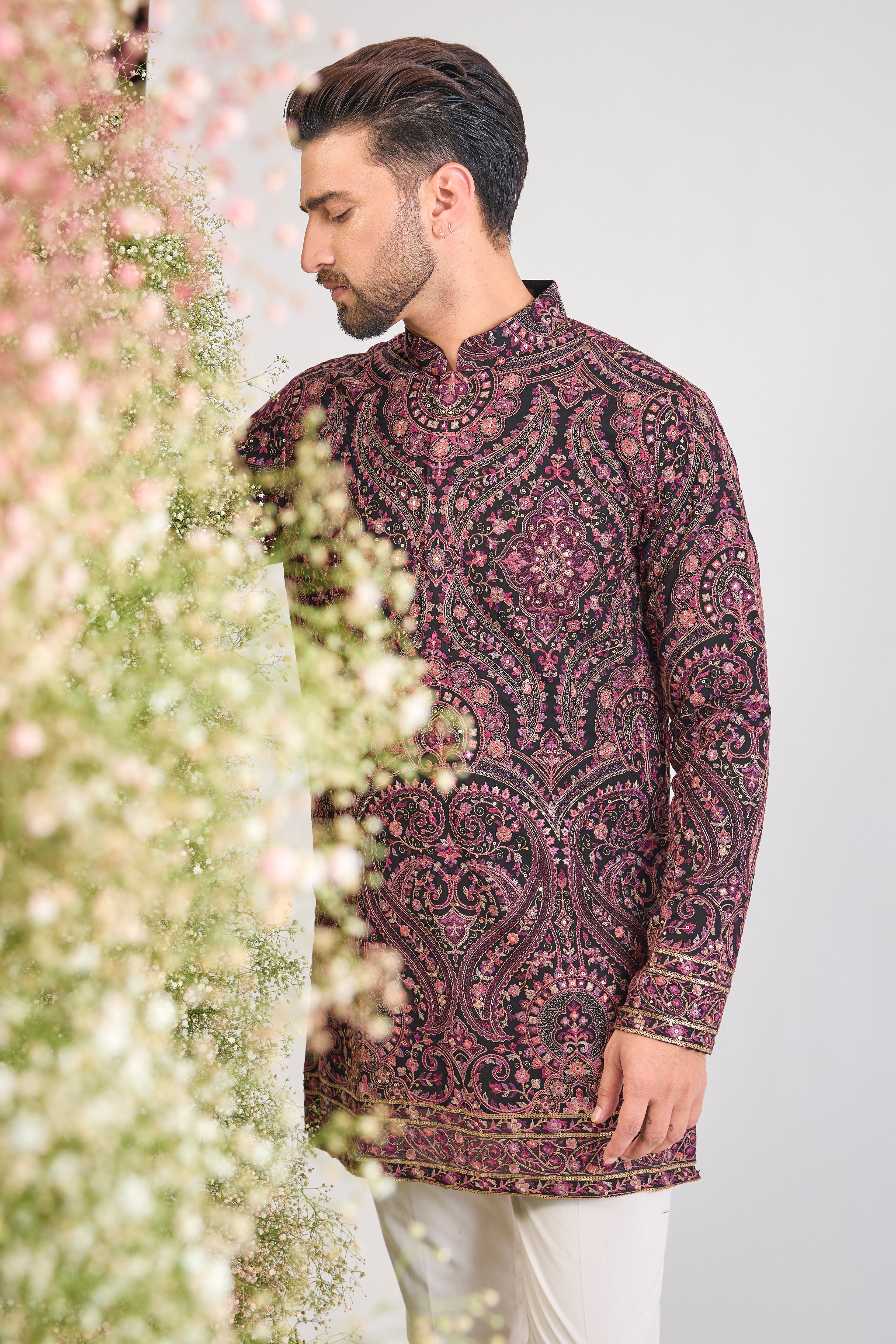 This Black Short Kurta showcases a stunning Jamawar Pattern executed in exquisite, Detailed Multi-threadwork Kashmiri Embroidery. The complex texture and rich detailing make this piece a magnificent fusion of heritage and high fashion.