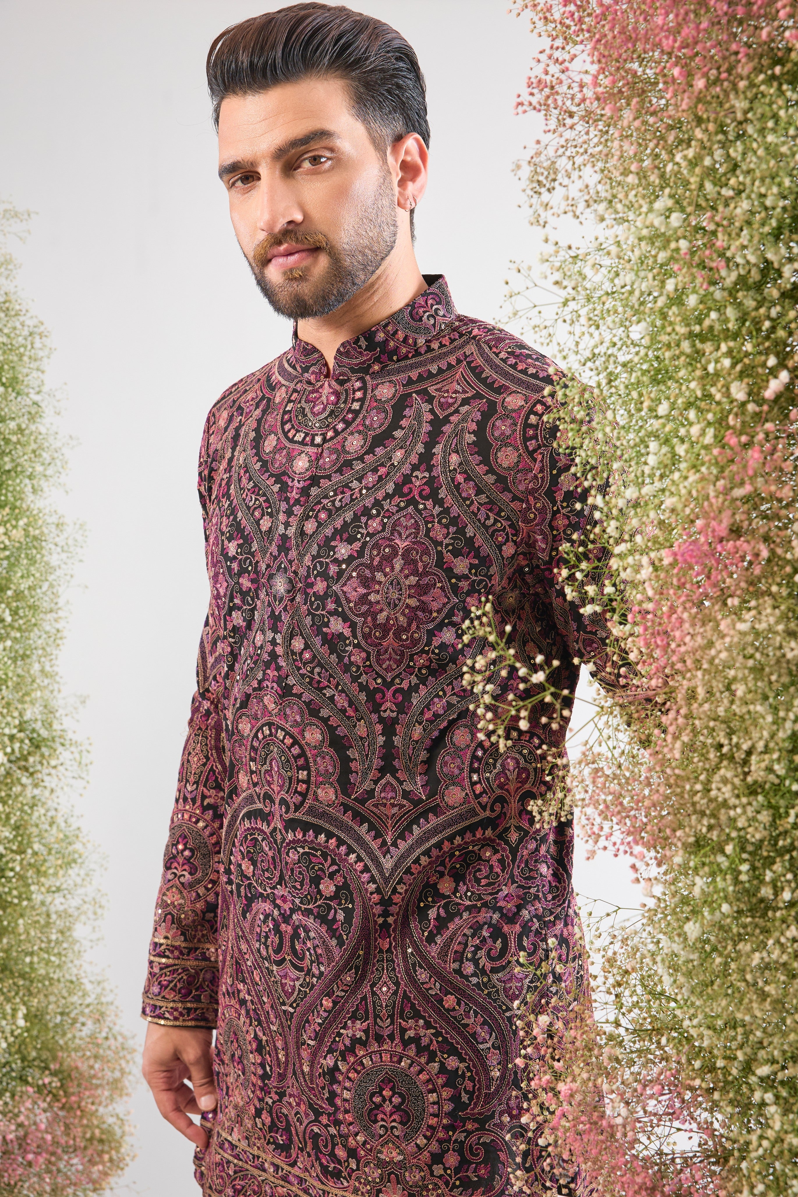 This Black Short Kurta showcases a stunning Jamawar Pattern executed in exquisite, Detailed Multi-threadwork Kashmiri Embroidery. The complex texture and rich detailing make this piece a magnificent fusion of heritage and high fashion.