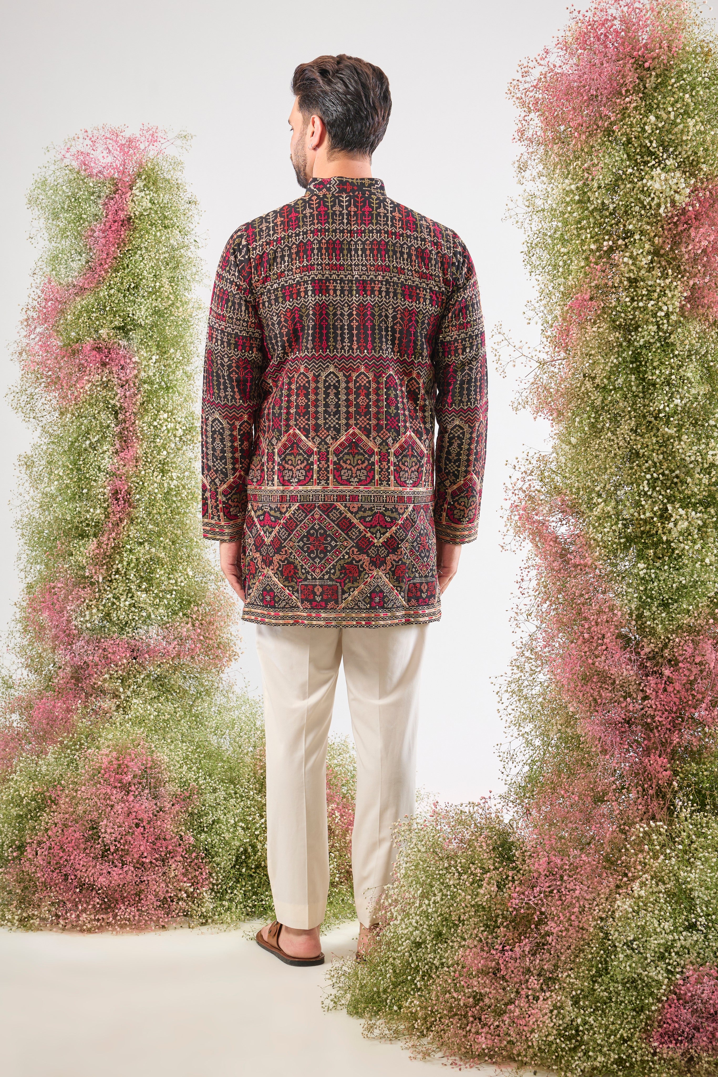 This Short Kurta showcases magnificent Intricate Multi-threadwork Kashmiri Embroidery, creating a beautiful textured surface. The Subtle Sequins are strategically placed to catch the light, ensuring a sophisticated shimmer.