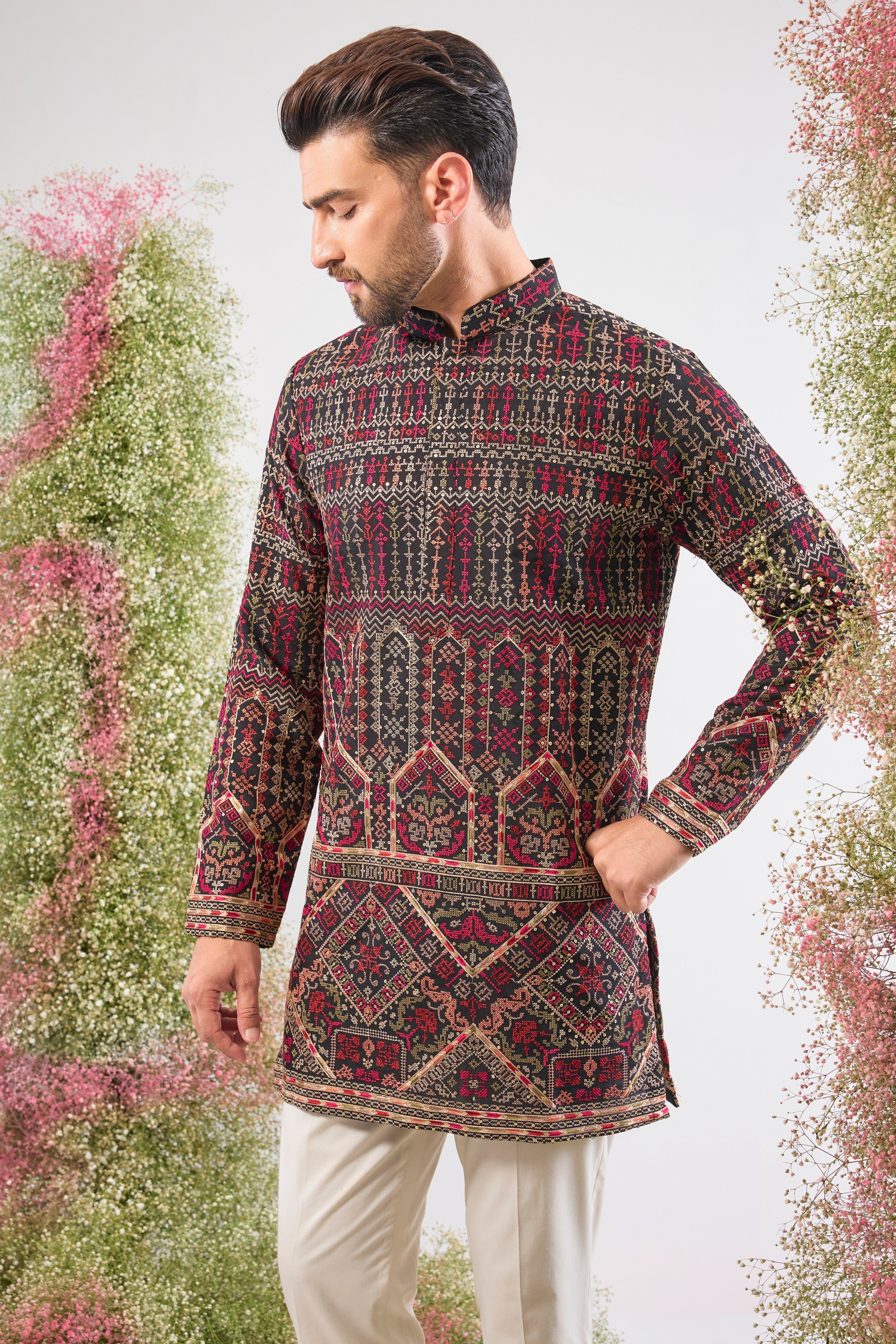 This Short Kurta showcases magnificent Intricate Multi-threadwork Kashmiri Embroidery, creating a beautiful textured surface. The Subtle Sequins are strategically placed to catch the light, ensuring a sophisticated shimmer.