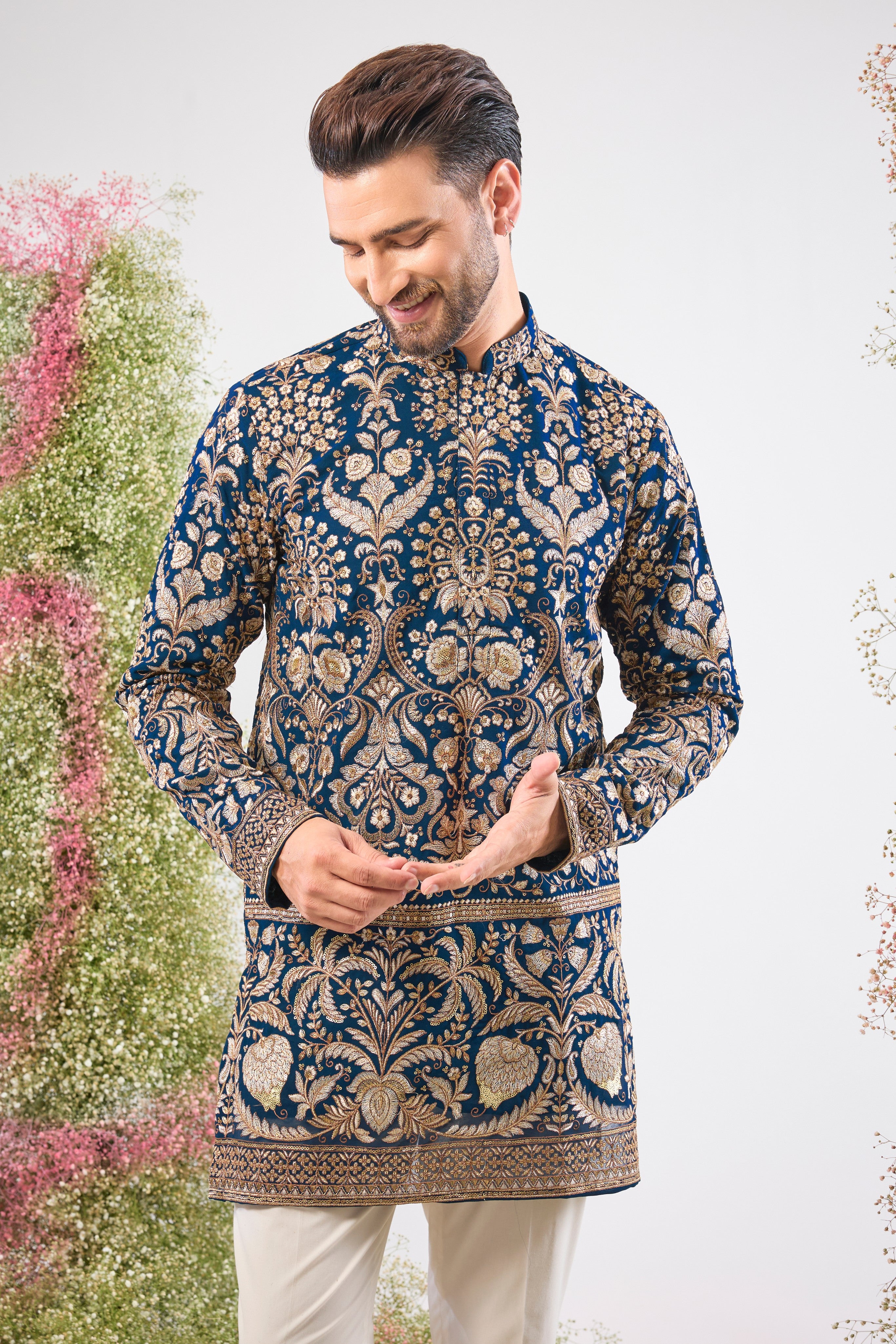 Experience the commanding grandeur of Royal Blue. This Hot Seller Short Kurta is adorned with opulent Heavy Zari Work, intricate Detailed Sequin and Floral Embroidery,