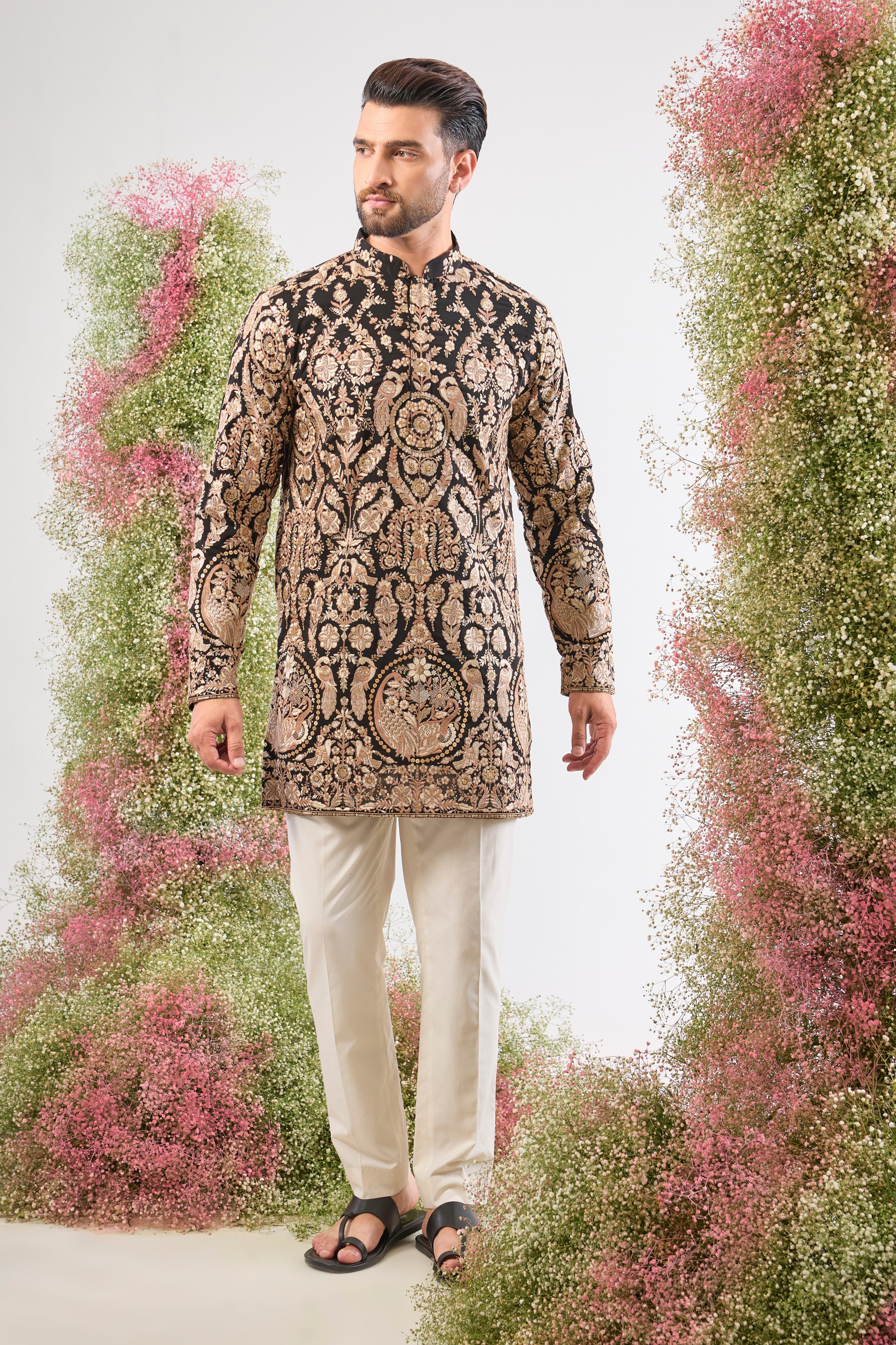 This Black Short Kurta showcases the weight of Heavy Zari Work, expertly framing Intricate Flora and Fauna Embroidery.