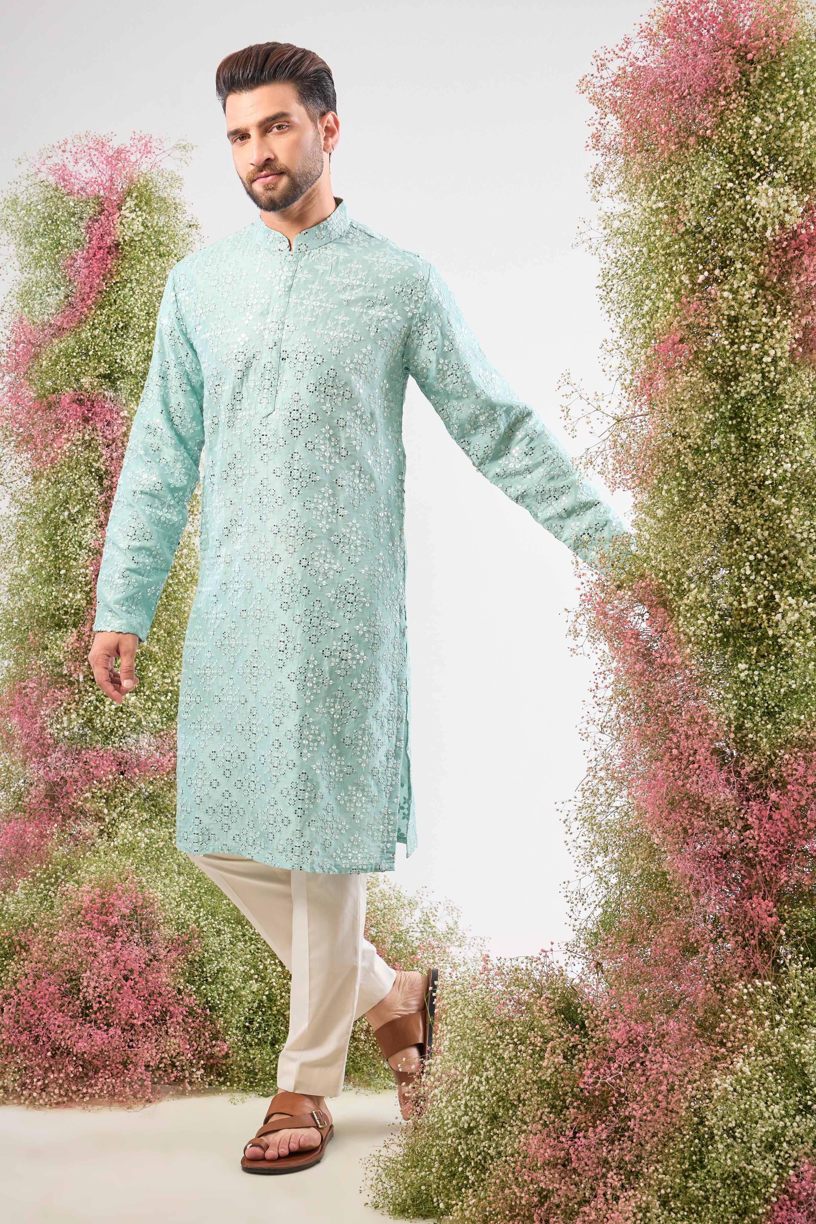 This Blue Mirror Work Long Kurta showcases dense Heavy Thread Work layered with spectacular Detailed Heavy Sequin Work, providing unmatched richness and sparkle across the long silhouette.