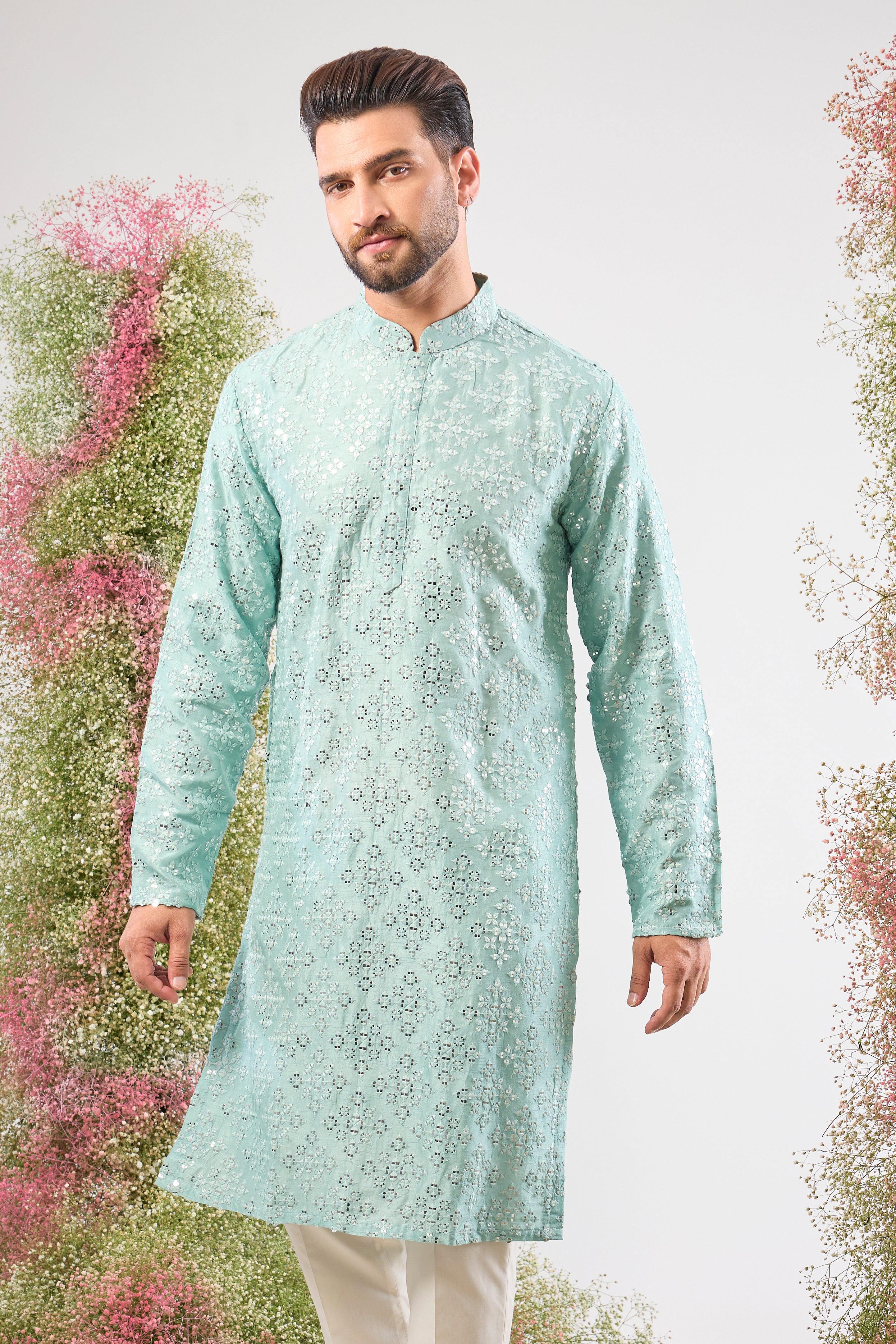 This Blue Mirror Work Long Kurta showcases dense Heavy Thread Work layered with spectacular Detailed Heavy Sequin Work, providing unmatched richness and sparkle across the long silhouette.