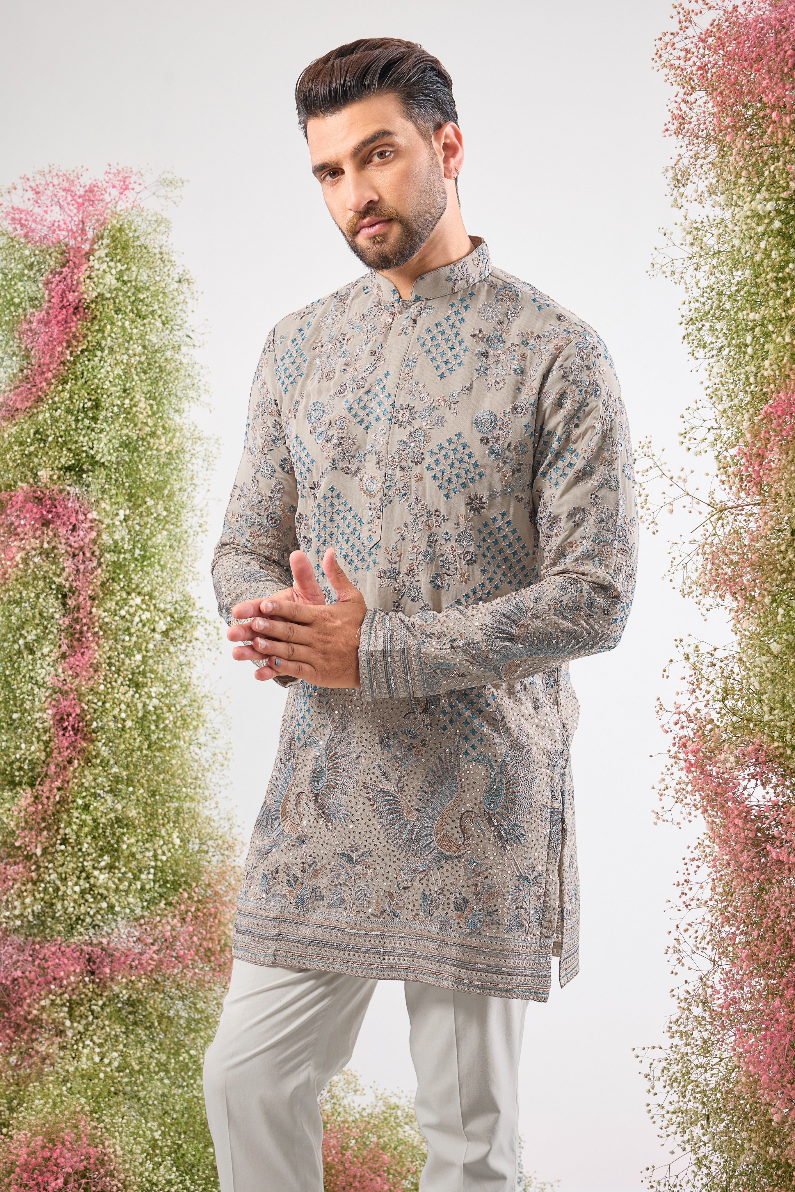 A symphony of neutral tones and detailed craft. This Nude Short Chikankari Kurta features