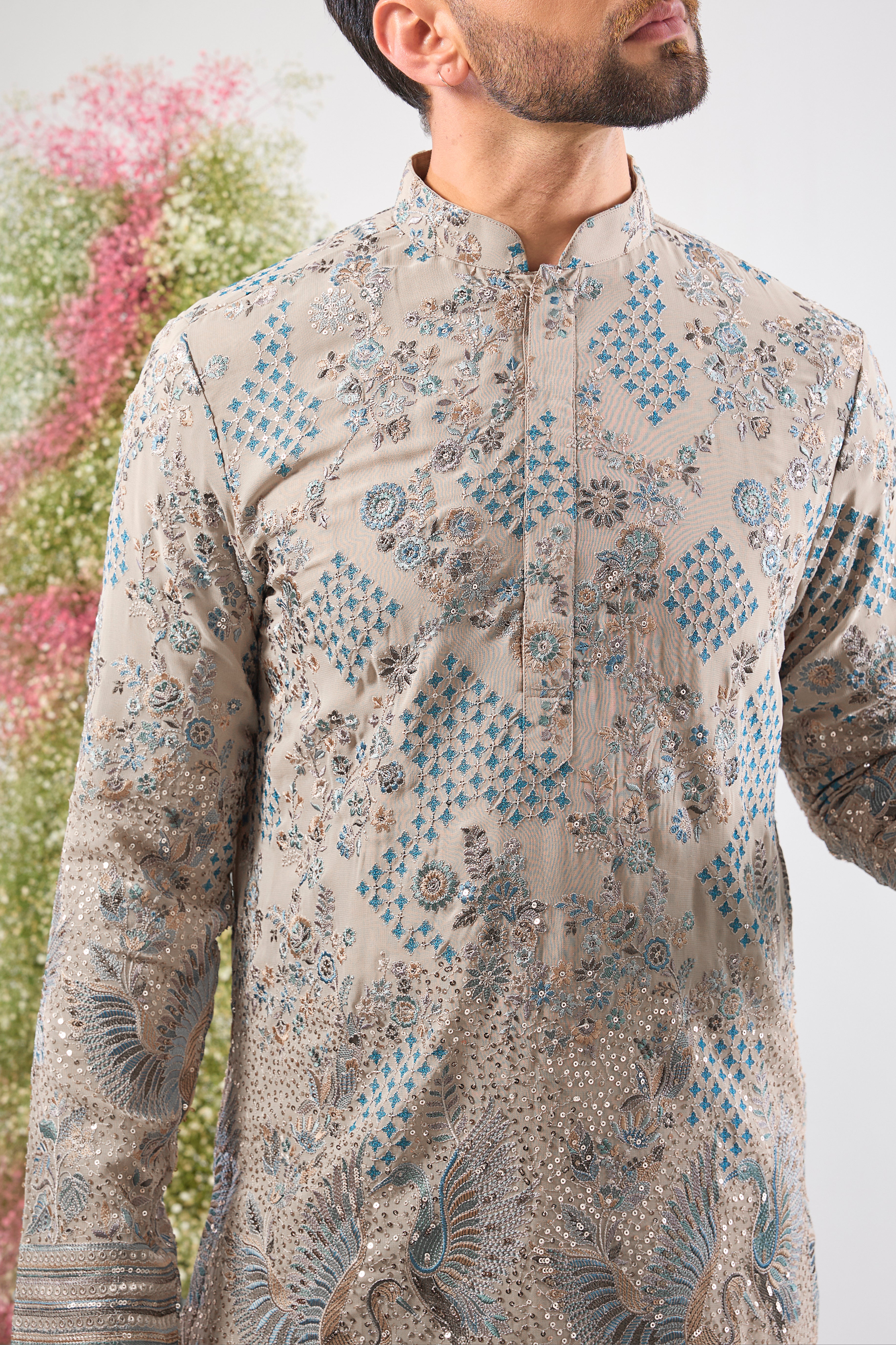 A symphony of neutral tones and detailed craft. This Nude Short Chikankari Kurta features