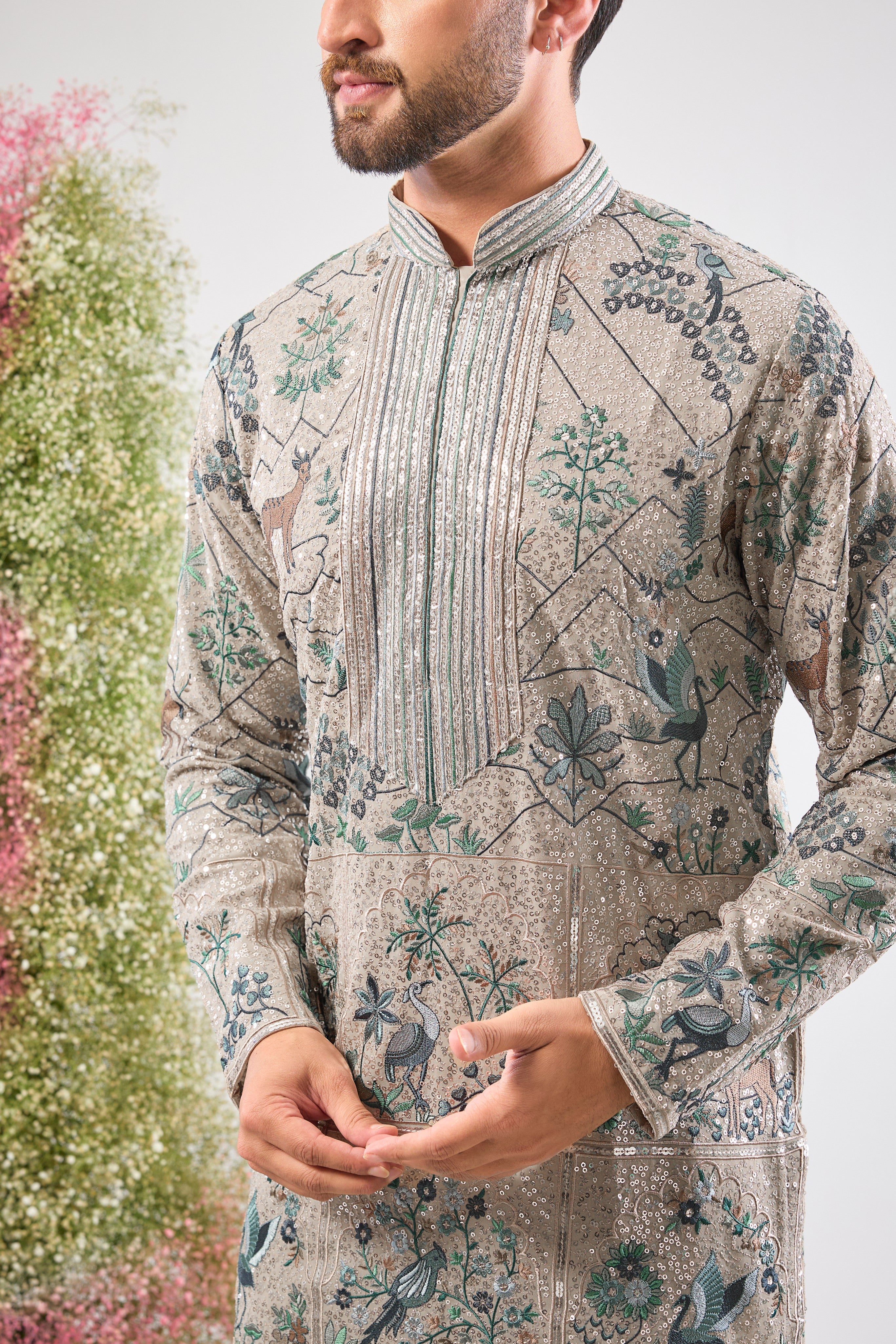 Our Full Sequined Kurta features exquisite Intricate Flora and Fauna Embroidery and a sophisticated Detailed Neckline. Simply stunning glamour.