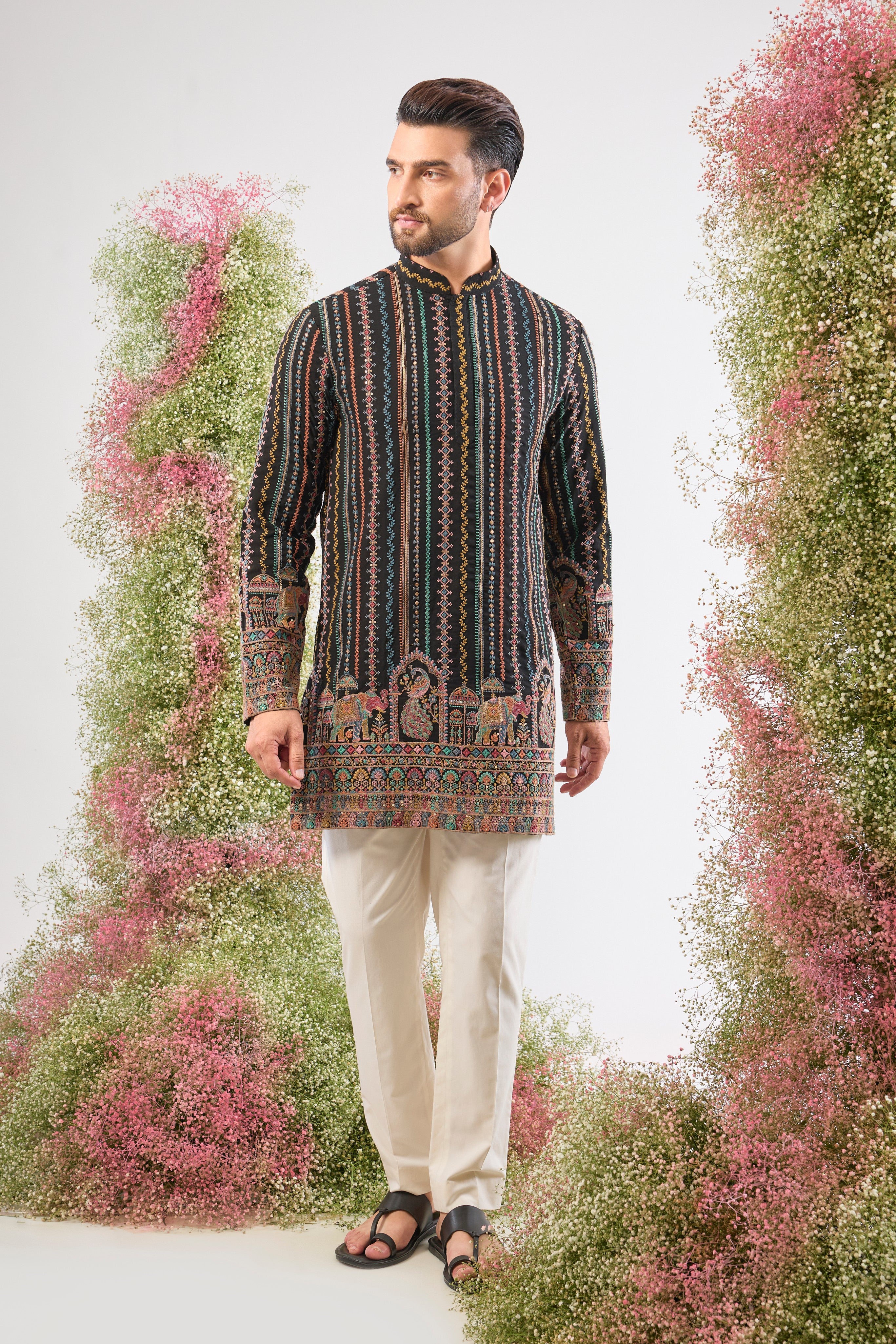 This Multi-coloured Short Kurta showcases a striking contrast between structured Detailed Thread Work Stripes and organic, l