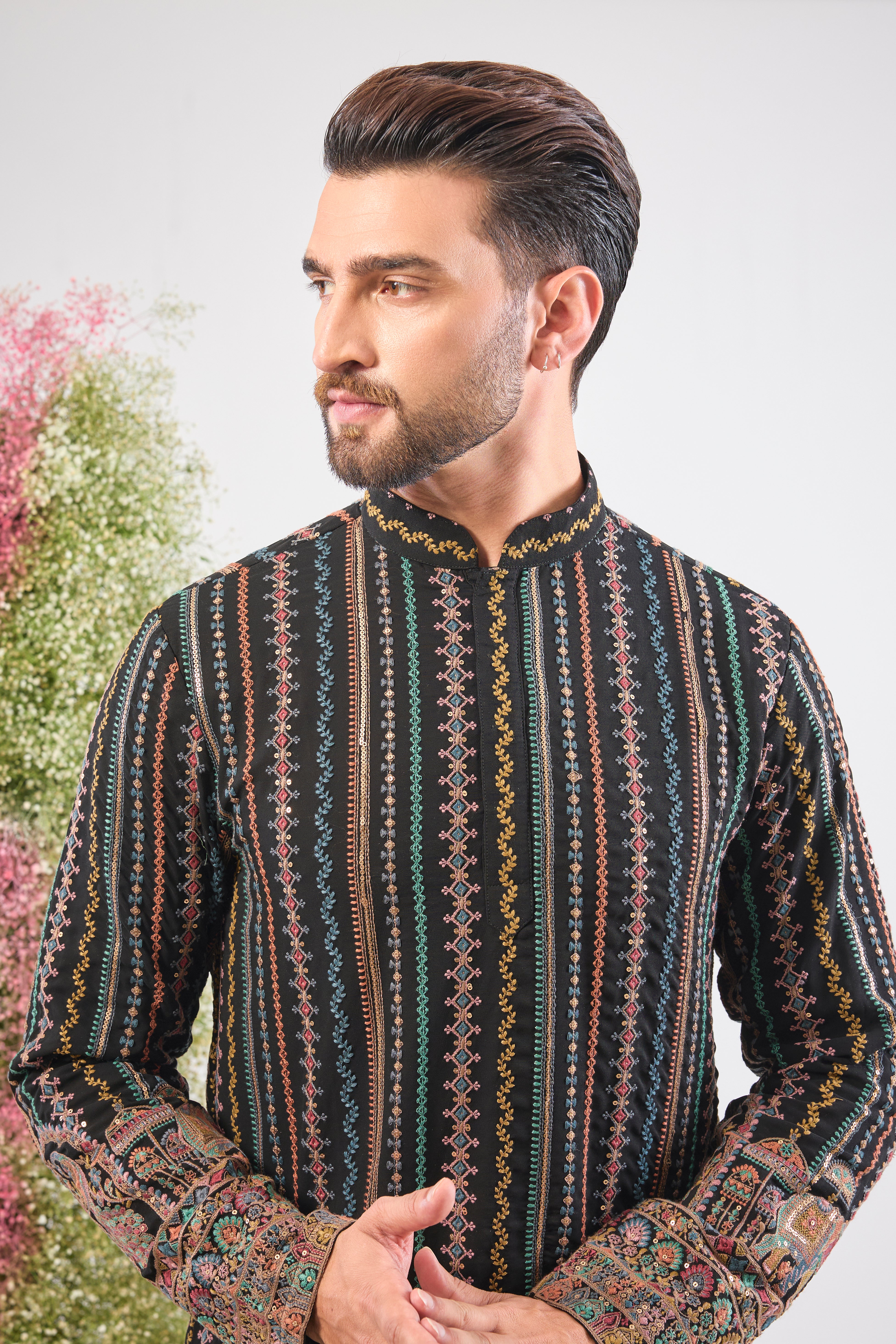 This Multi-coloured Short Kurta showcases a striking contrast between structured Detailed Thread Work Stripes and organic, l