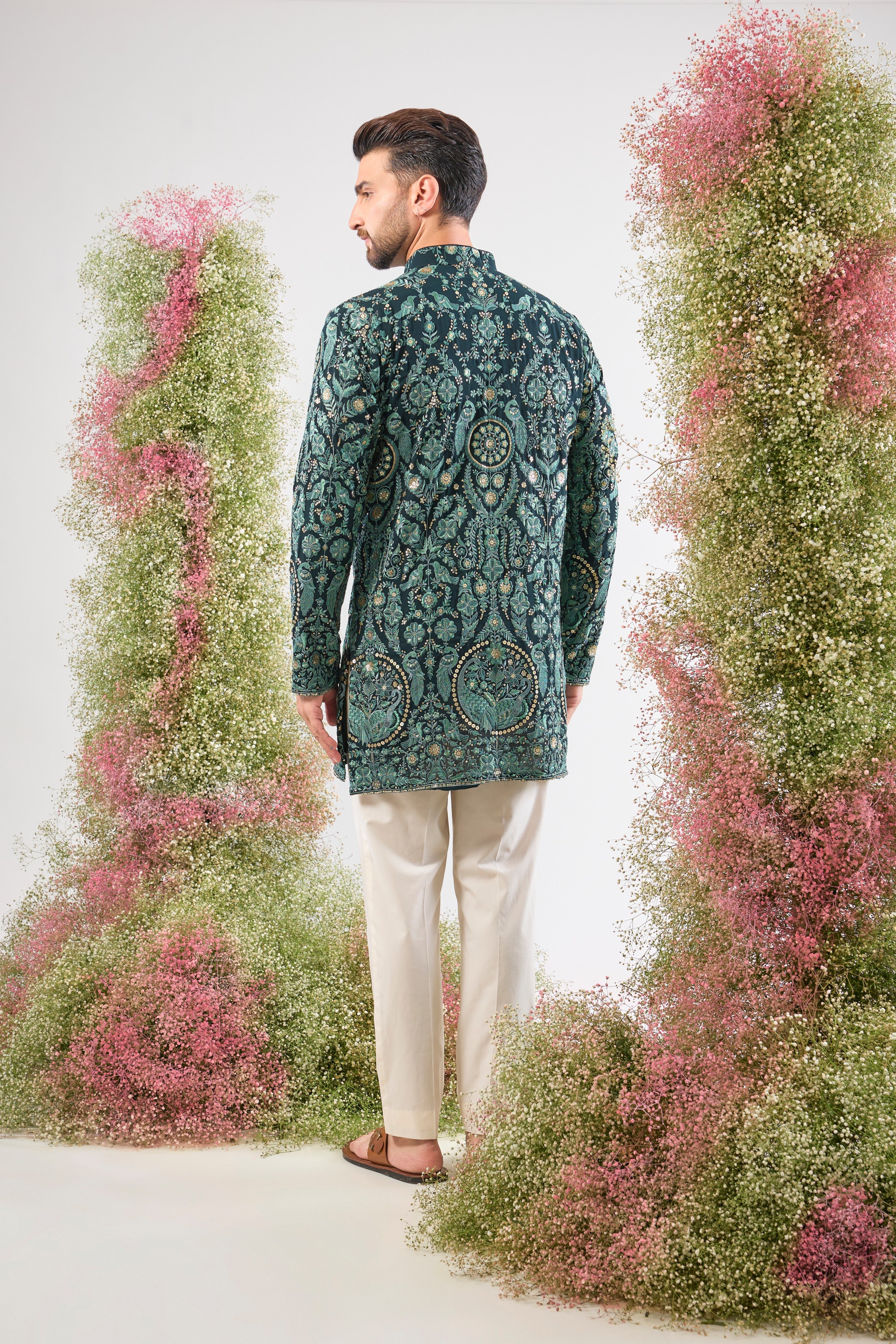 This Short Thread Work Kurta is lavishly detailed with intricate craftsmanship, featuring Detailed Flora and Fauna Embroidery and brilliant Detailed Sequins. The rich colour and complex texture create an opulent look designed to stand out.