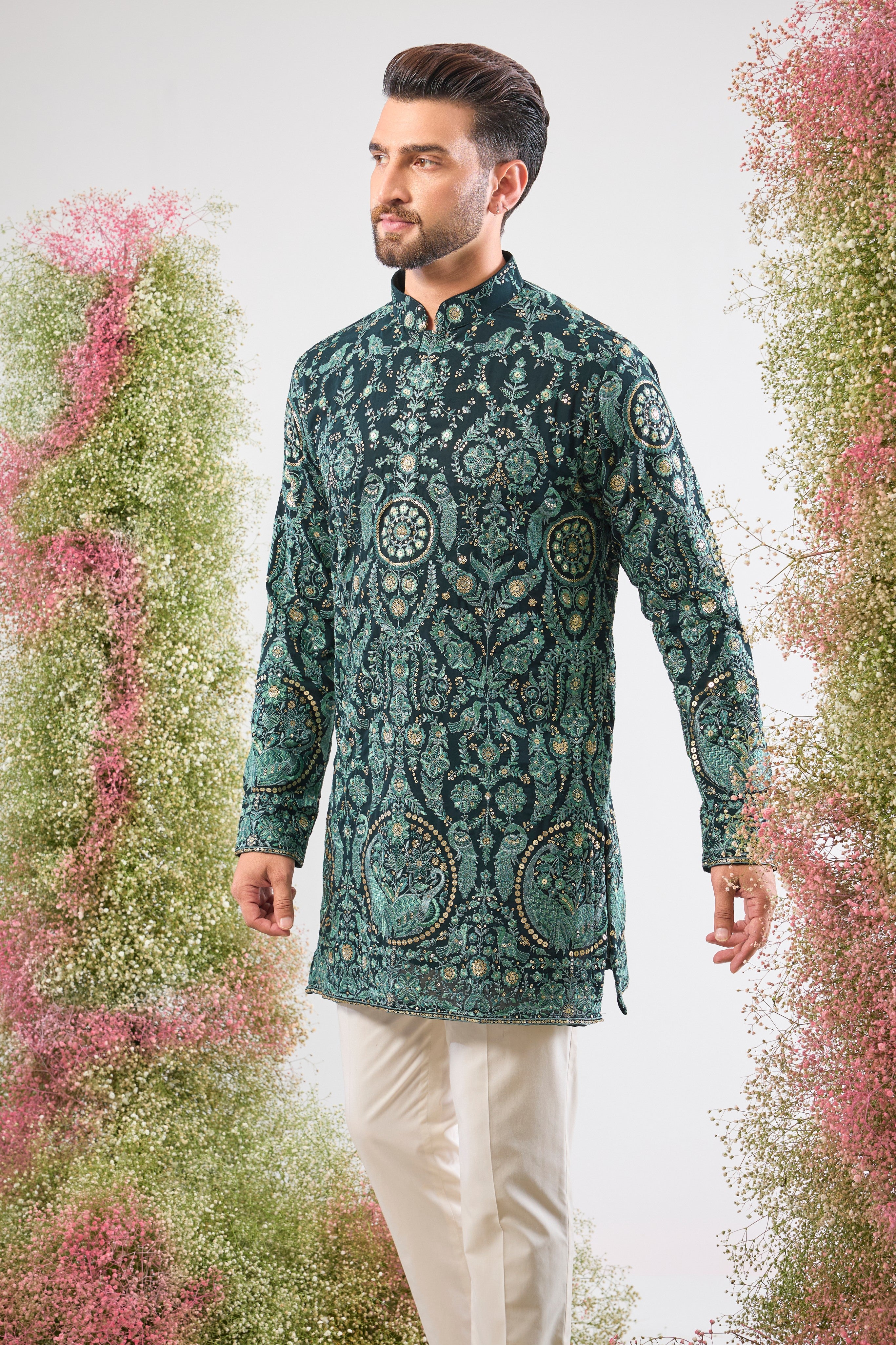 This Short Thread Work Kurta is lavishly detailed with intricate craftsmanship, featuring Detailed Flora and Fauna Embroidery and brilliant Detailed Sequins. The rich colour and complex texture create an opulent look designed to stand out.
