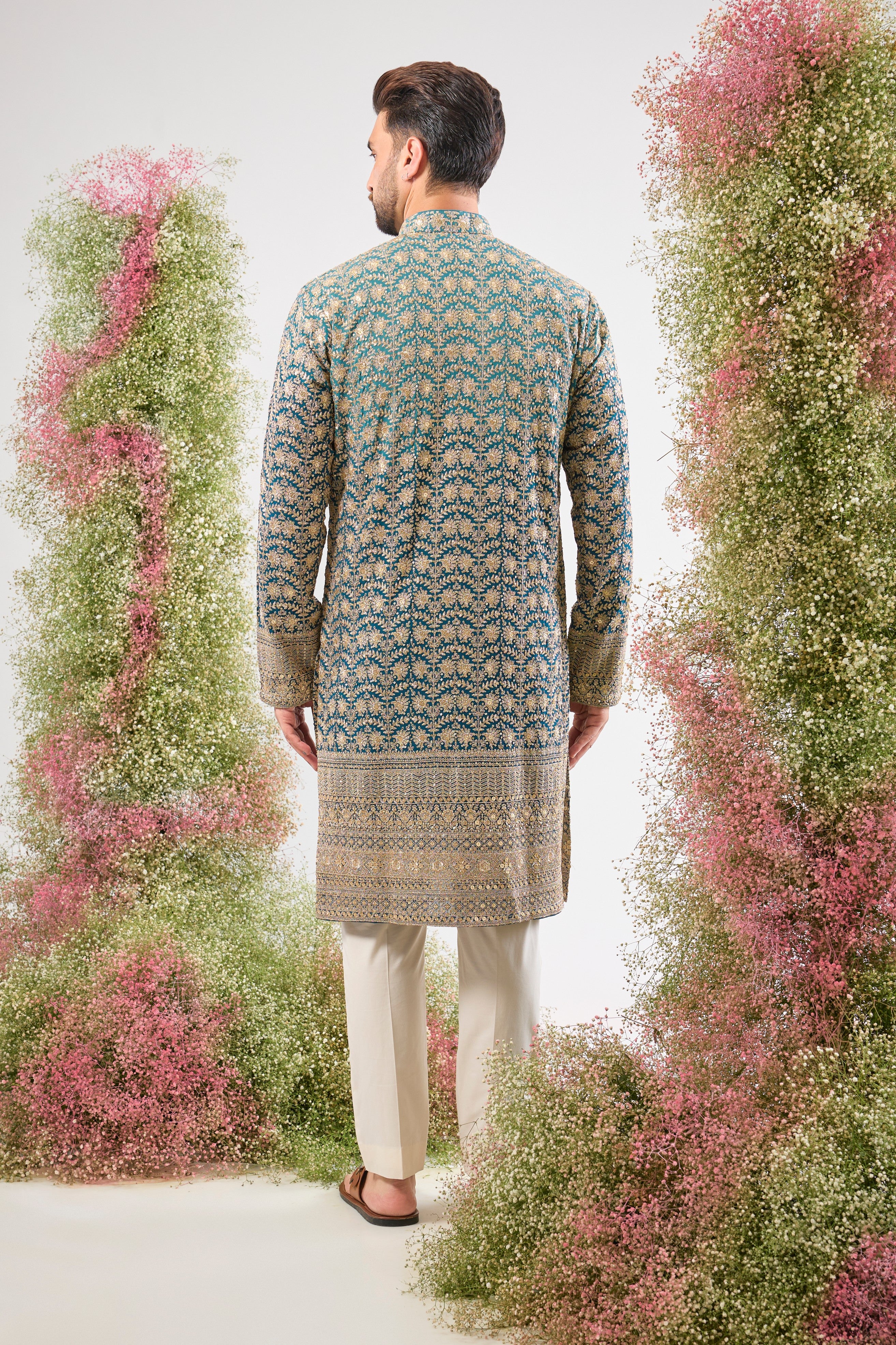 his super classy Blue Ombre Shaded Long Kurta showcases a breathtaking gradient effect and is richly adorned with Heavy Zari and Sequin Work. The fluid design and intricate shimmer make this a truly modern heirloom