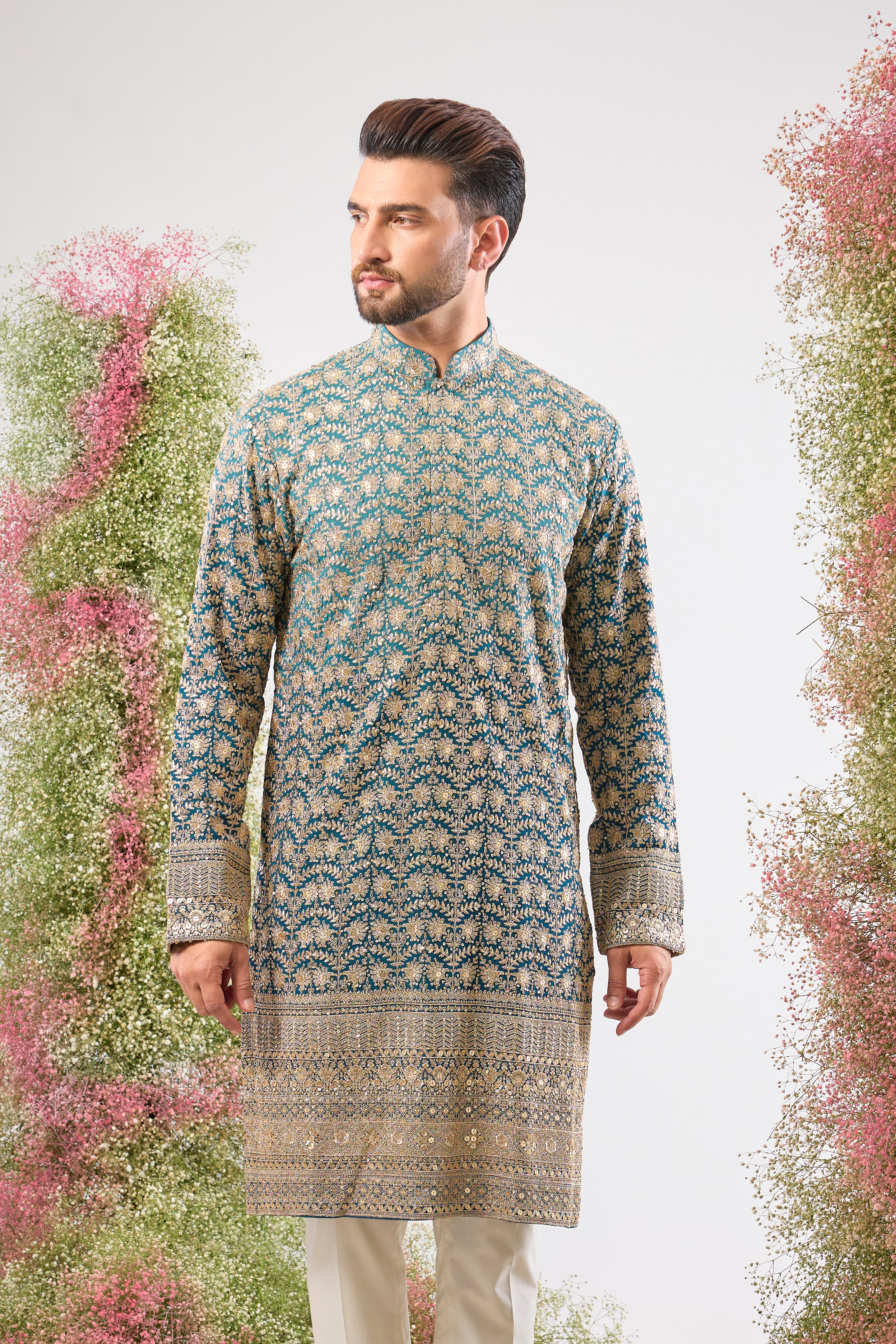 his super classy Blue Ombre Shaded Long Kurta showcases a breathtaking gradient effect and is richly adorned with Heavy Zari and Sequin Work. The fluid design and intricate shimmer make this a truly modern heirloom