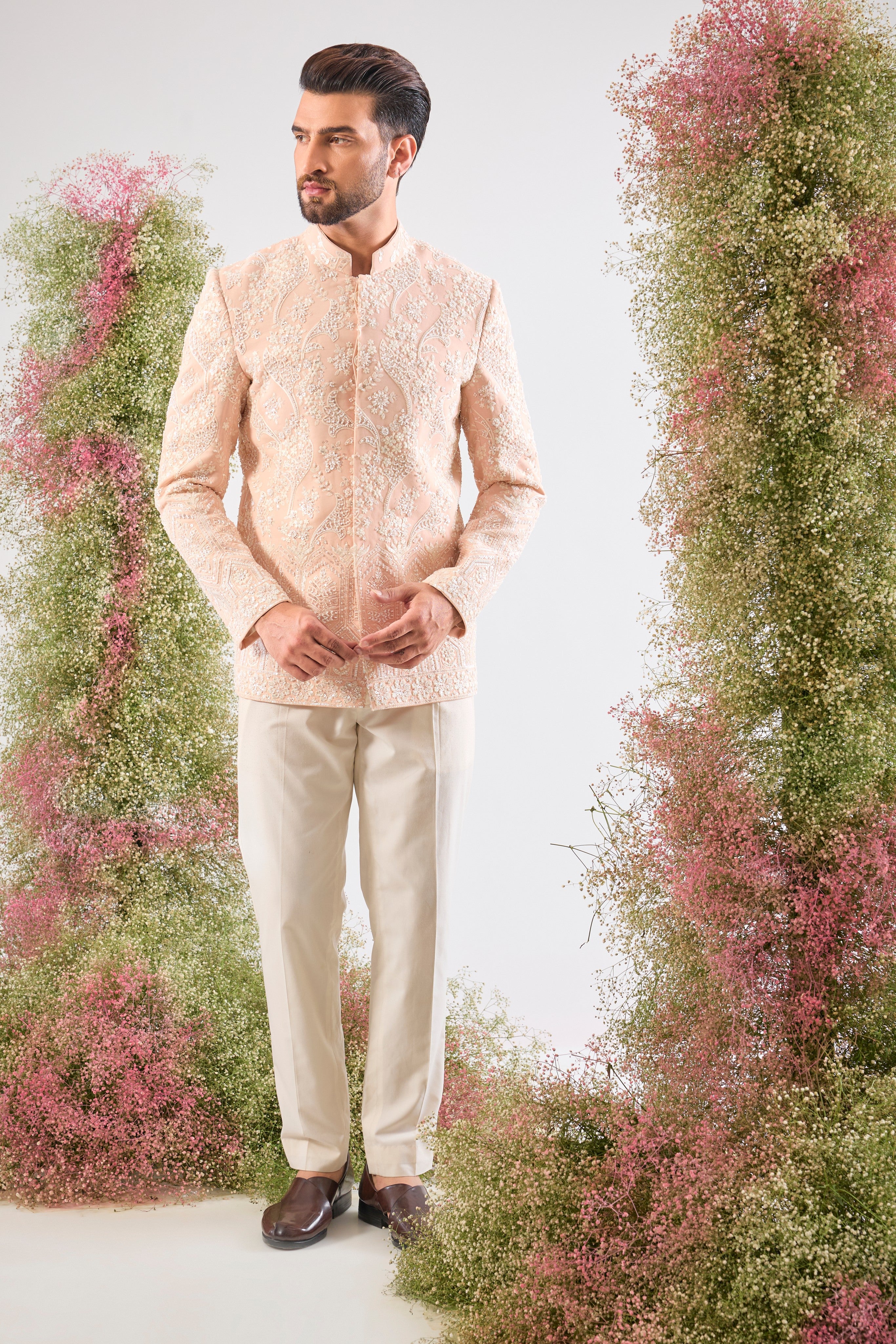 This Hand Embroidered Bandhgala features rich, textural detail where Intricate Floral Embroidery is lavishly decorated with brilliant White Cut Dana and Sequins.