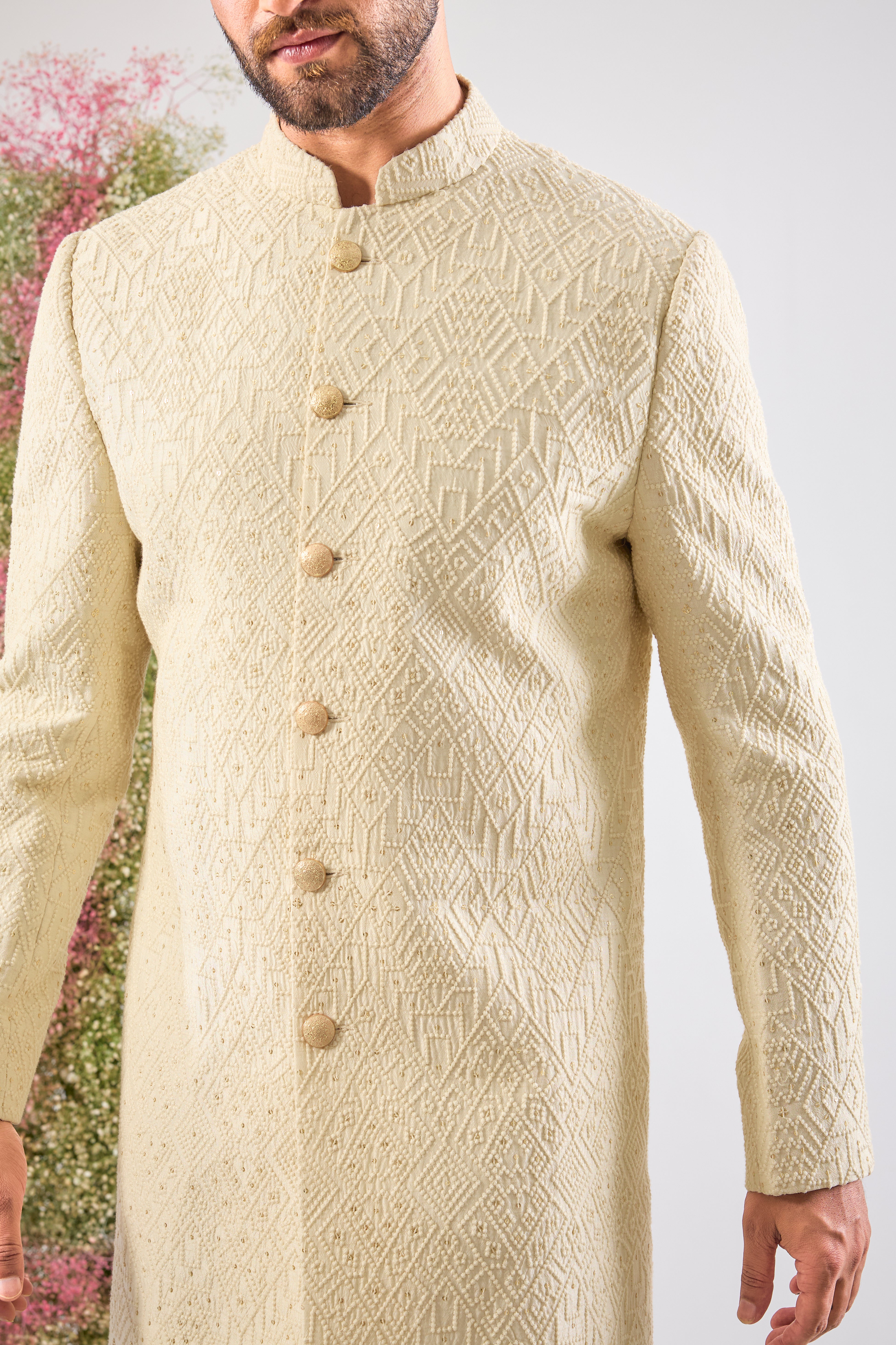 This Short Sherwani showcases intense Heavy Thread Work in a mesmerizing Geometrical Pattern, creating unparalleled texture and depth.