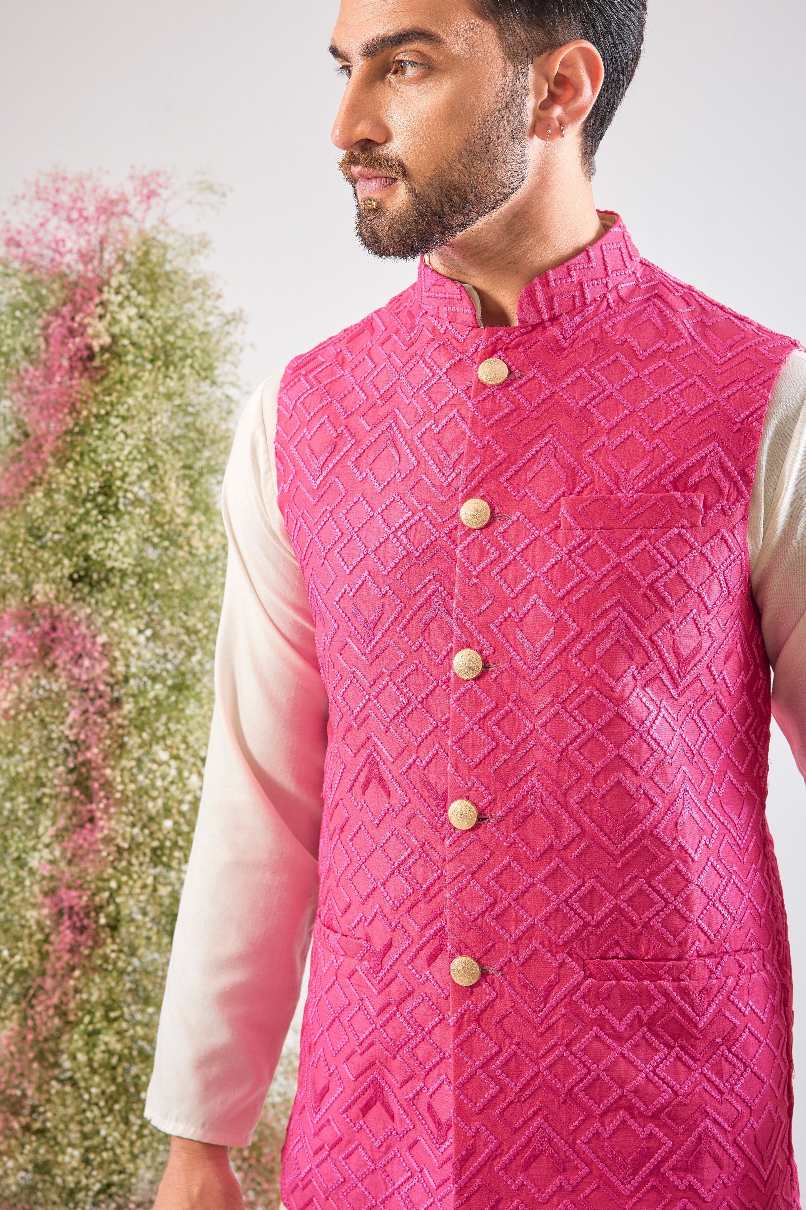 This Hot Pink Nehru Jacket showcases intense Heavy Thread Work in a sharp Geometrical Pattern, creating unparalleled richness and depth. This jacket is the perfect layering piece to infuse energy and sophistication into any formal ensemble