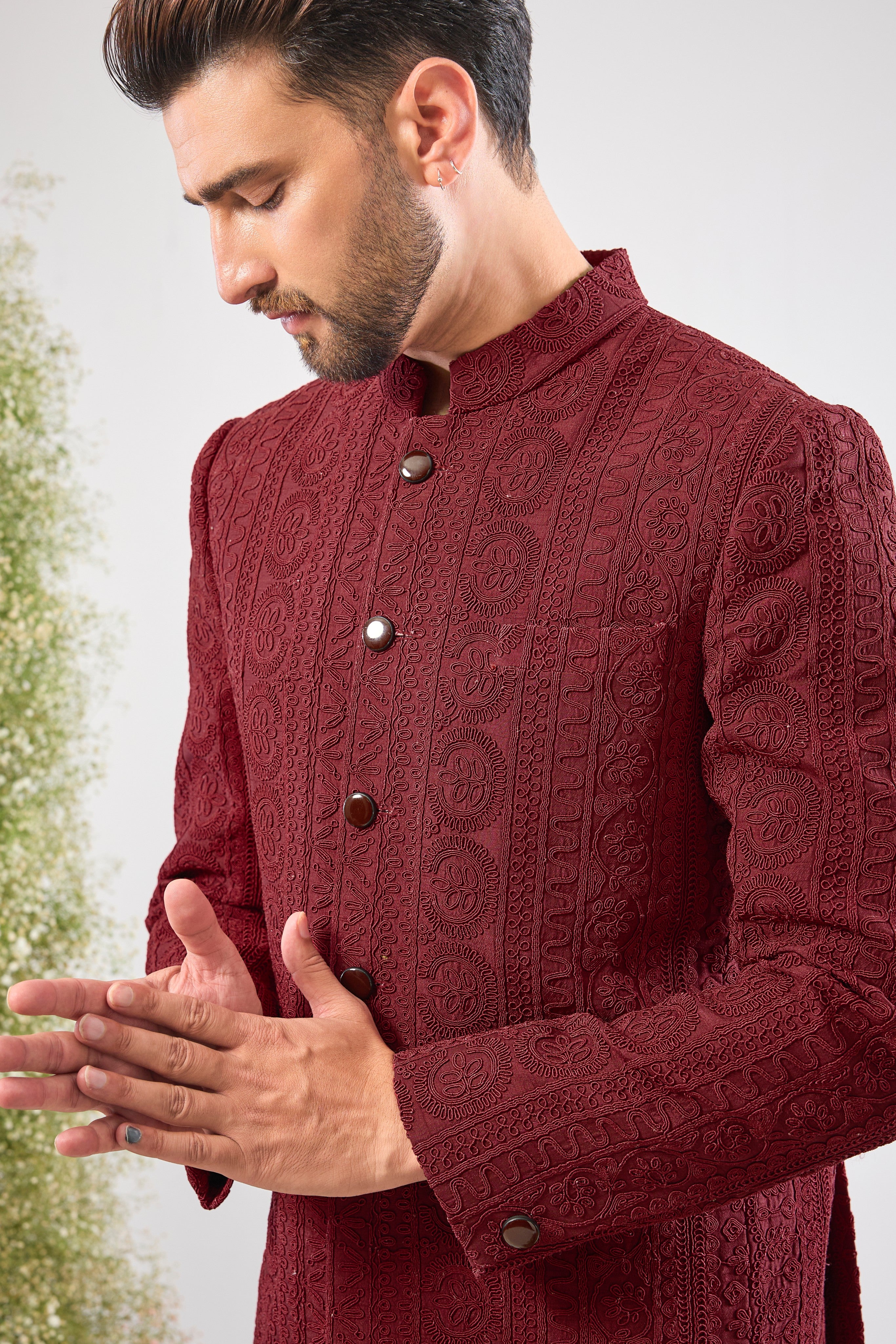 This Maroon Bandhgala is incredibly classy and subtle, showcasing spectacular Heavy Doori Work that creates luxurious, textural depth. Designed for a discerning eye, this outfit guarantees a super classy look without any bling