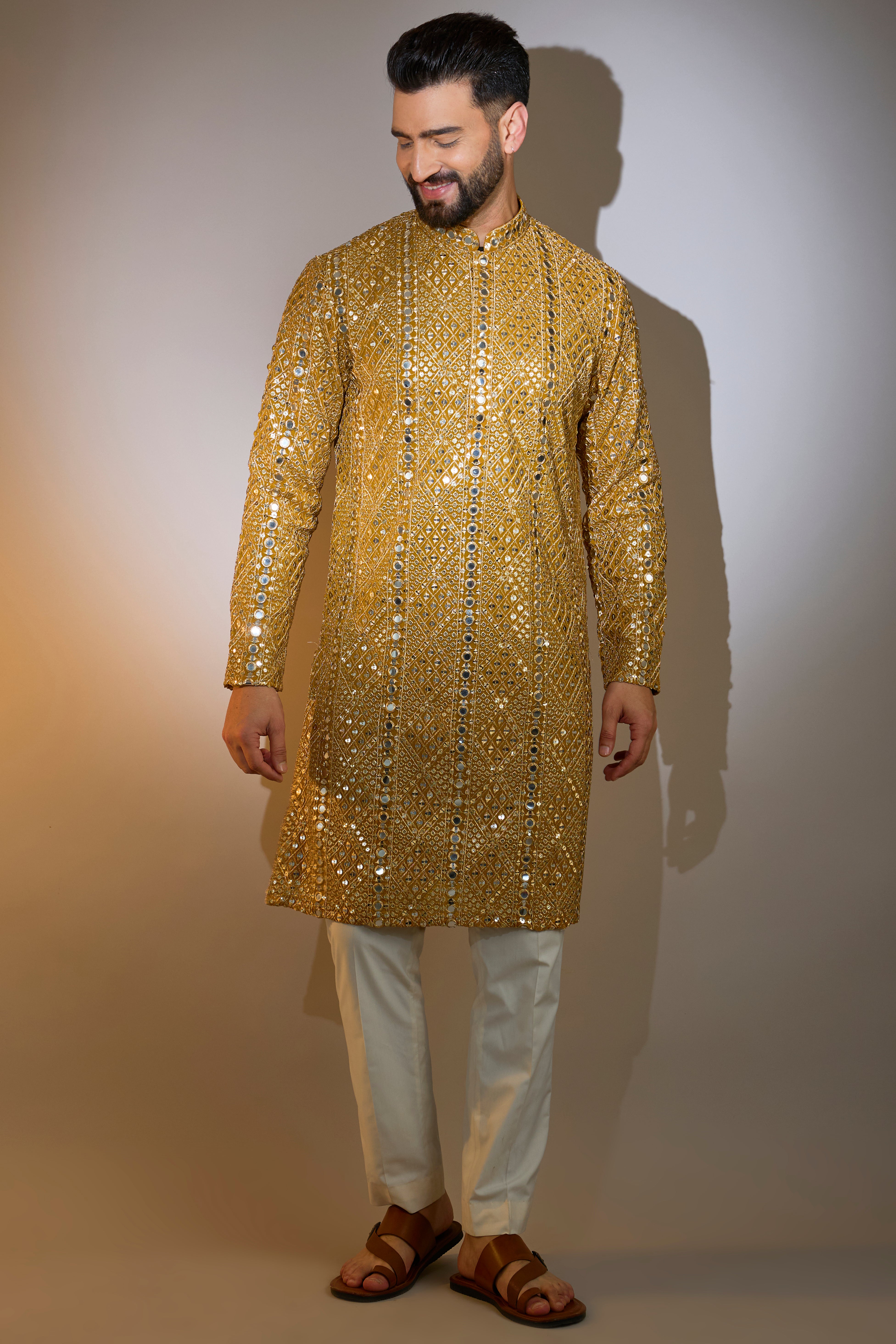 mustard mirror work kurta with intricate zari work